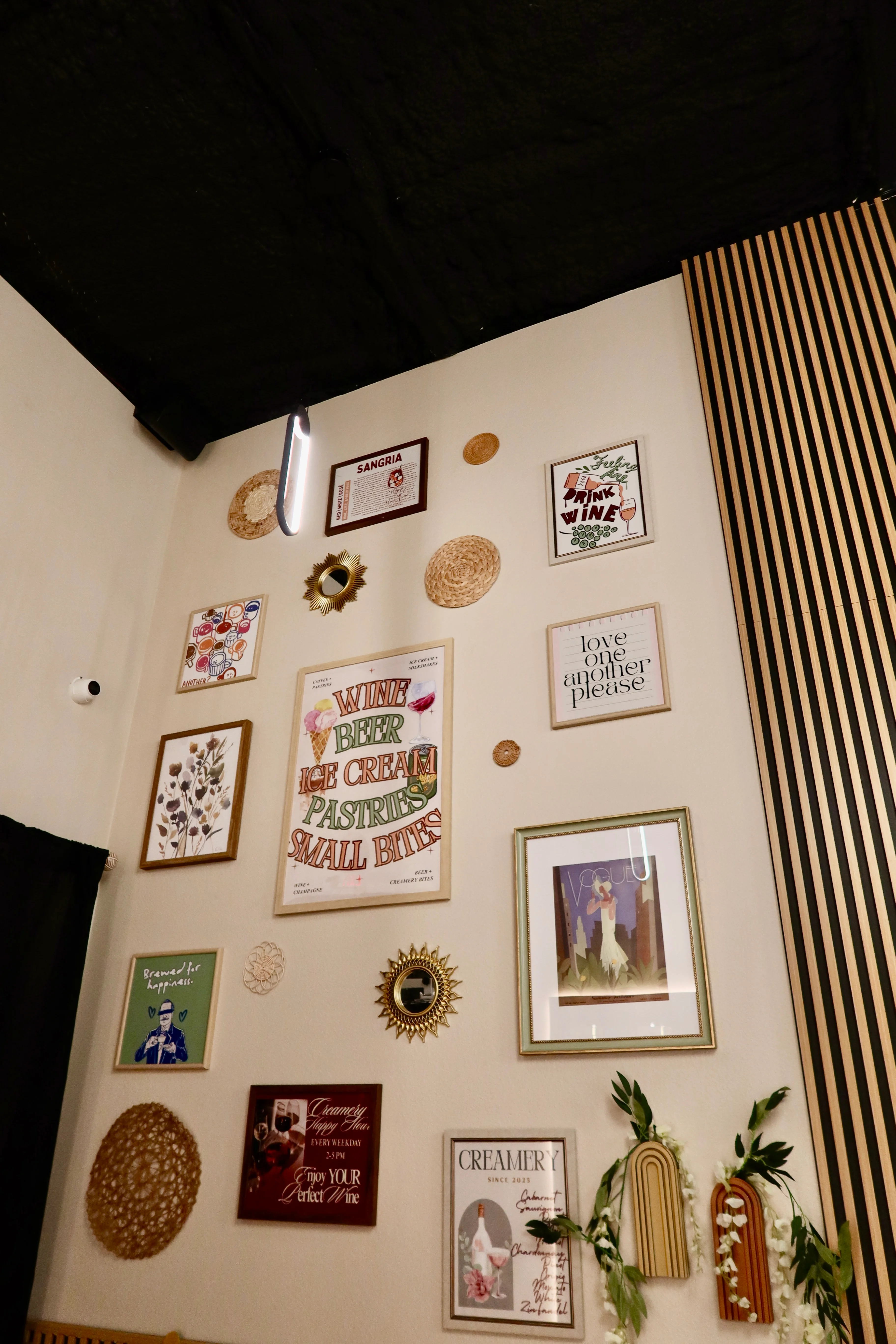 Charming restaurant wall decor with framed art and warm lighting