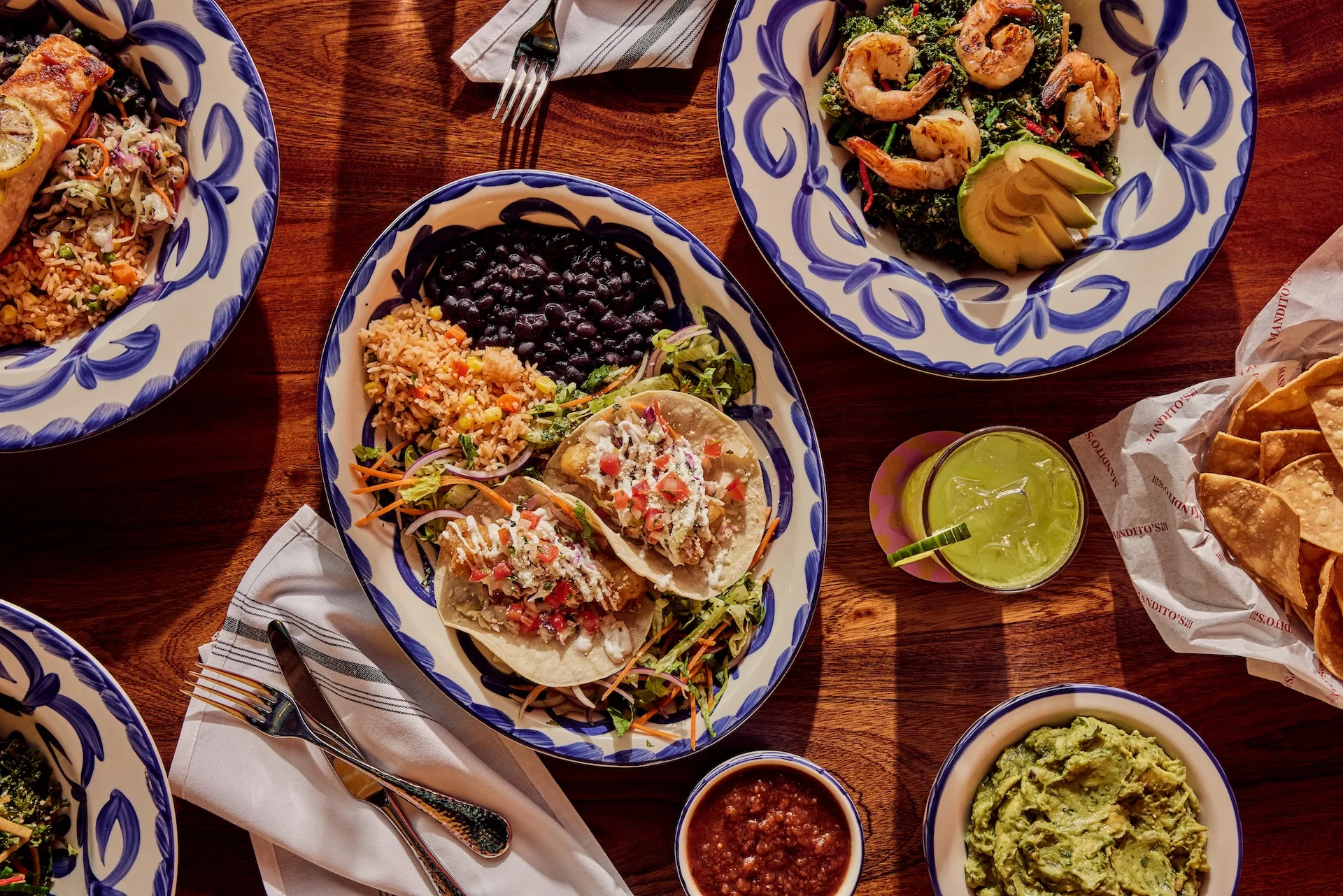 Colorful Mexican taco platter with shrimp and guacamole