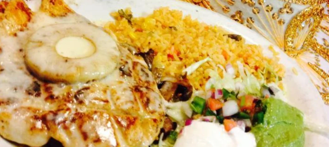 Grilled Mexican carne asada with rice and fresh toppings