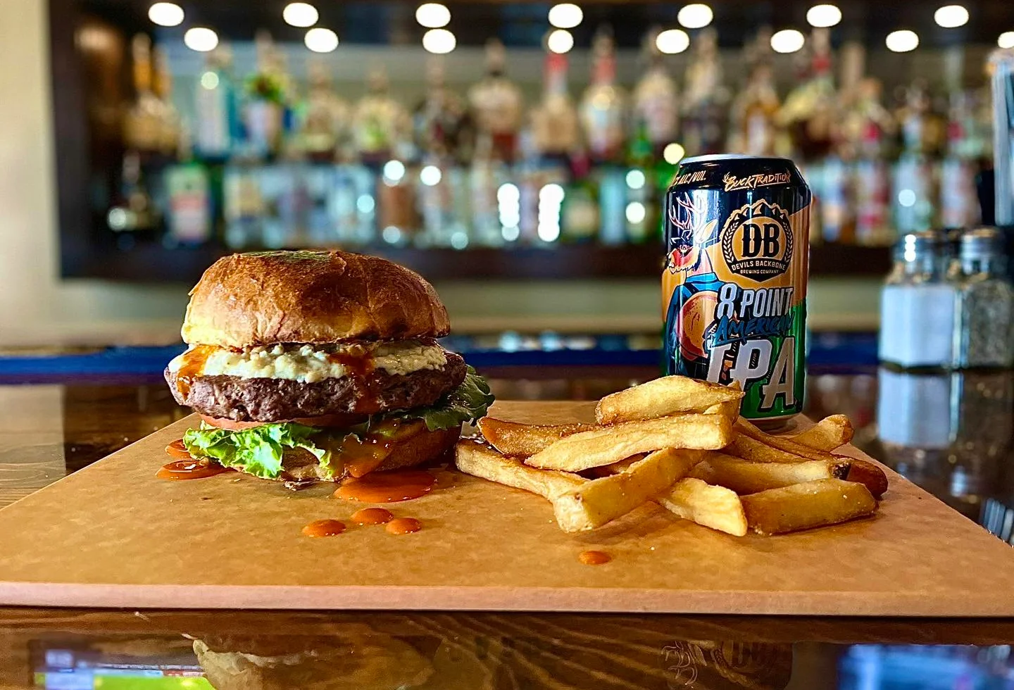Juicy American cheeseburger with fries and craft beer