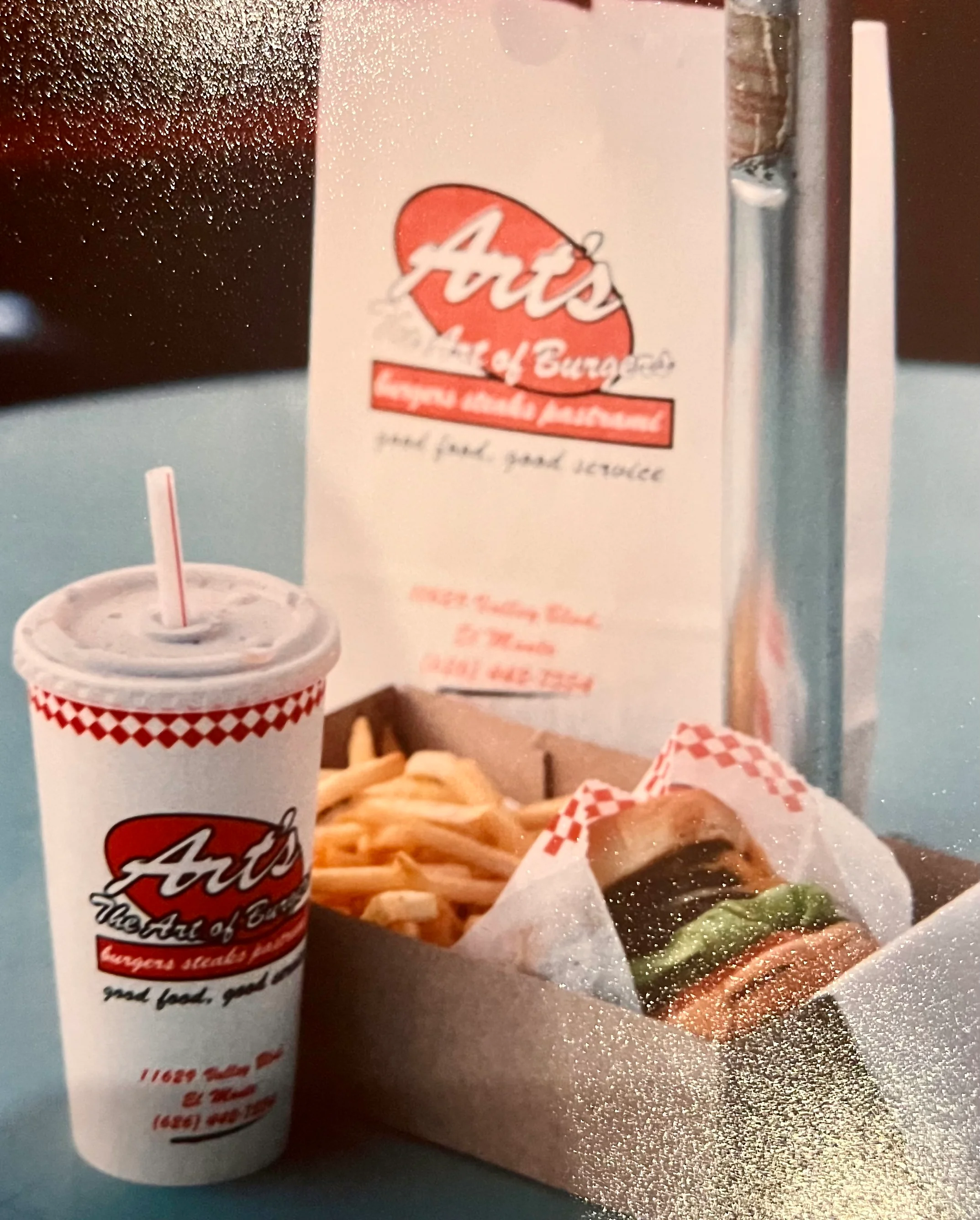 Classic American cheeseburger with fries and a milkshake