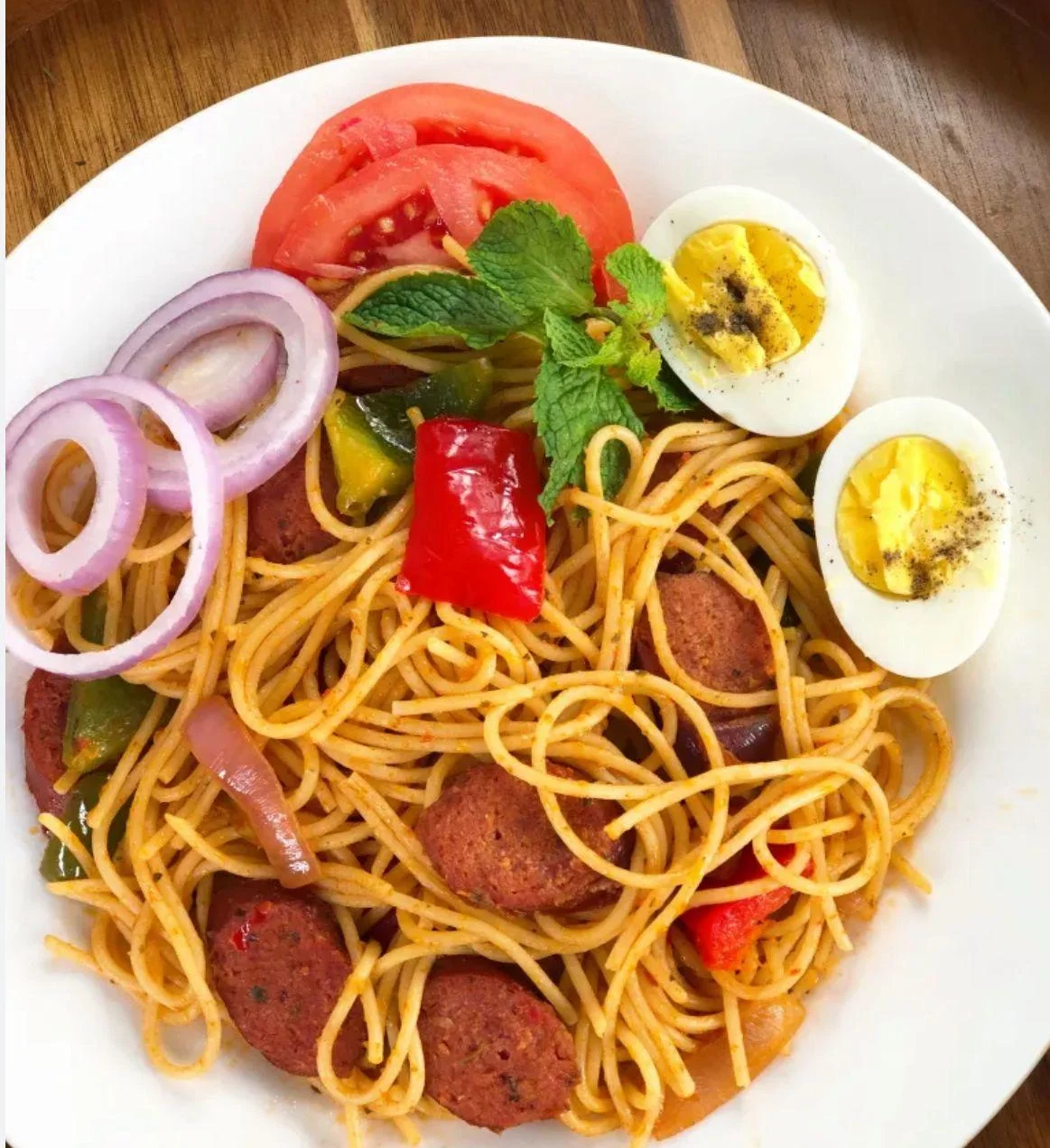 SPAGHETTI HOTDOGS WITH HERRING FRIED EGGS WITH PLANTAIN