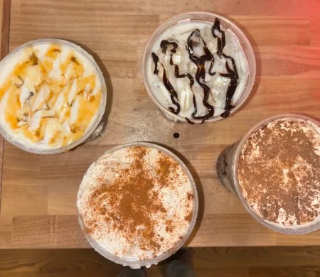 Assorted coffee drinks with whipped cream and toppings