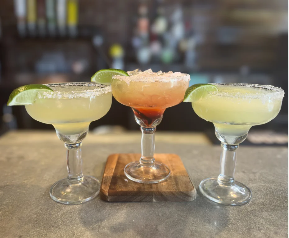 Colorful margaritas served in a modern bar setting