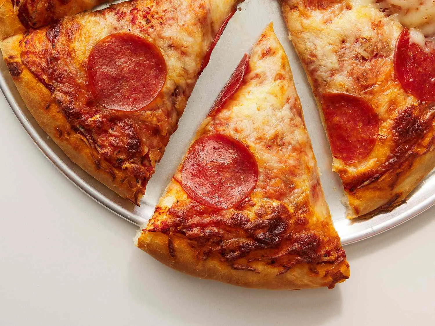 Classic pepperoni pizza on a silver platter
