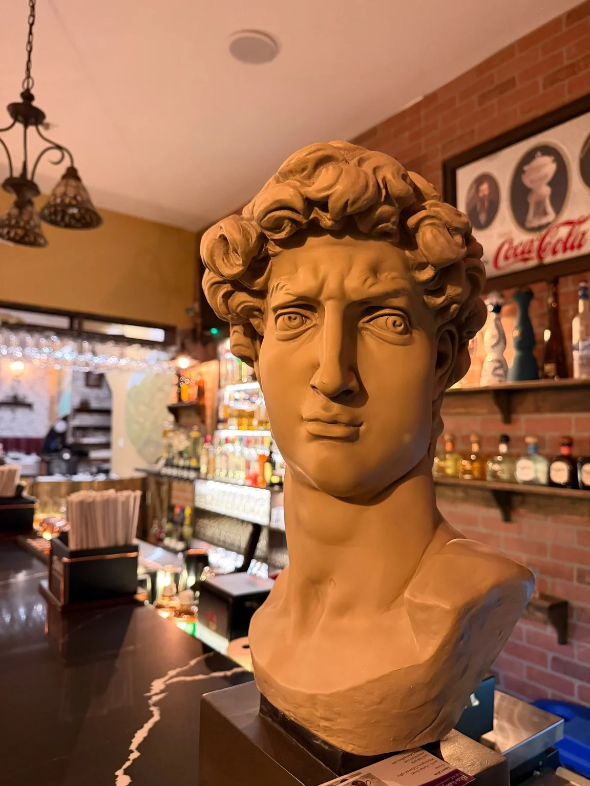 Classical sculpted bust beside the bar at Villa Italiana