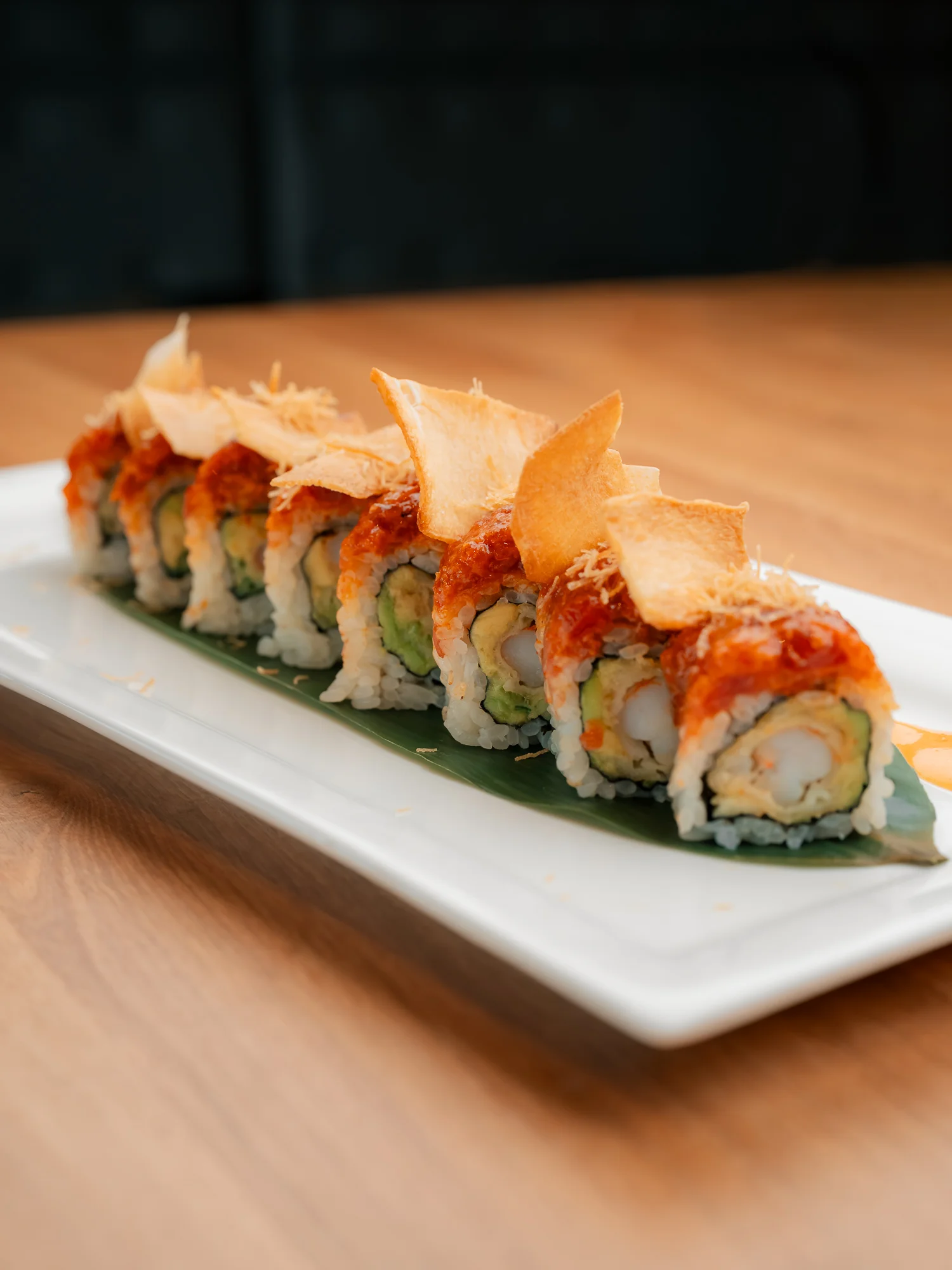 A selection of small dishes featuring different types of seafood, vegetables, and garnishes. The plates showcase a variety of colors and textures.
