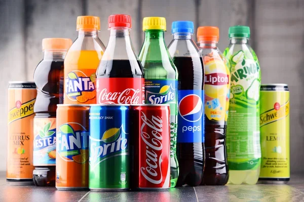 Variety of soft drinks in bottles and cans