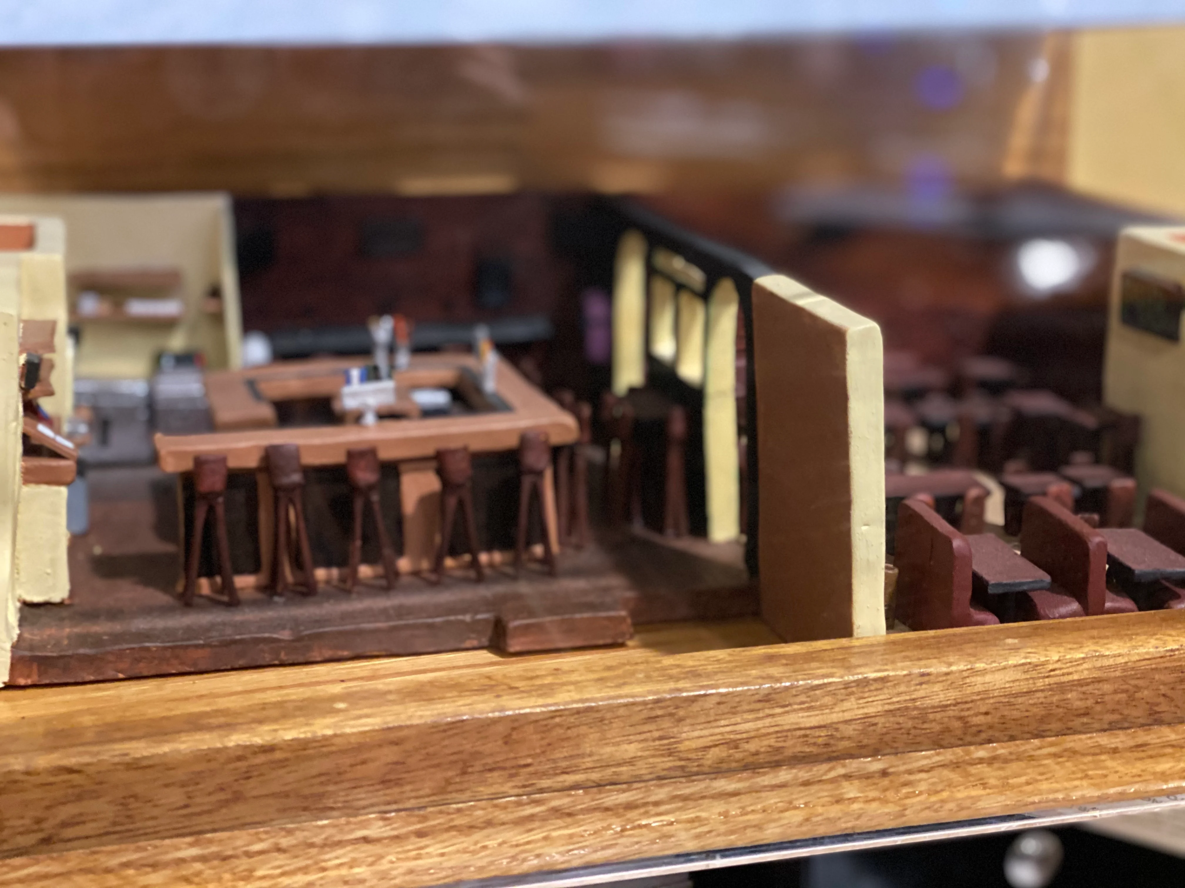 Detailed model of a restaurant interior with bar and seating area