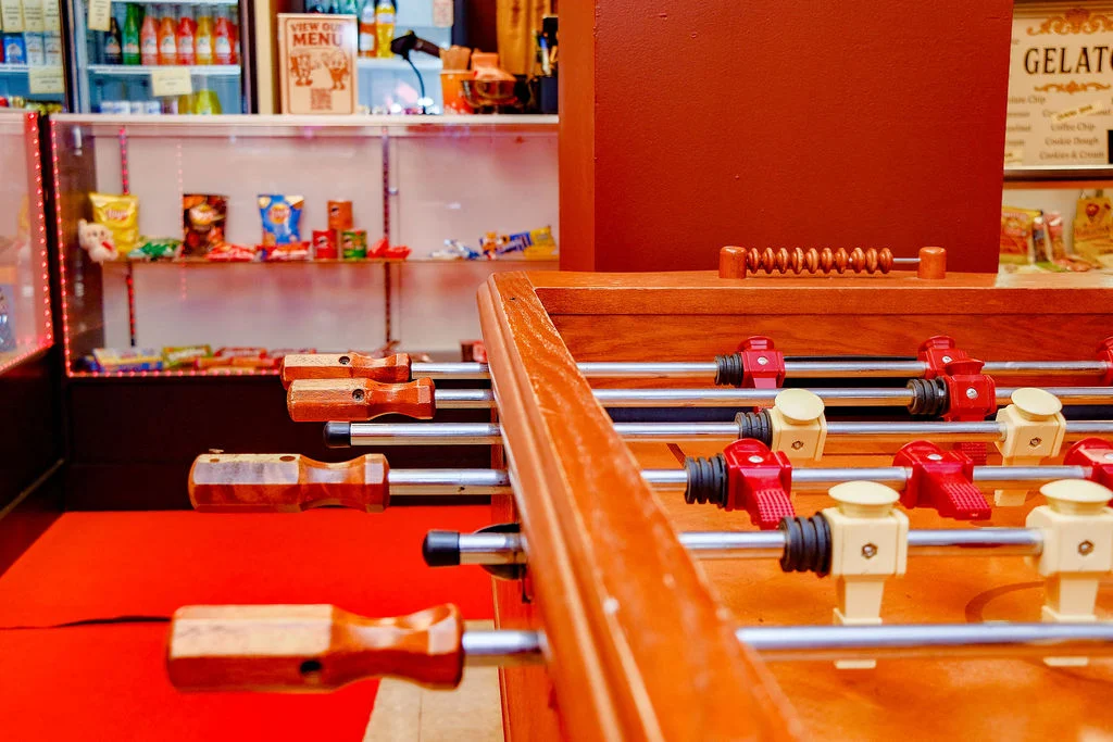 Foosball table in a vibrant restaurant setting