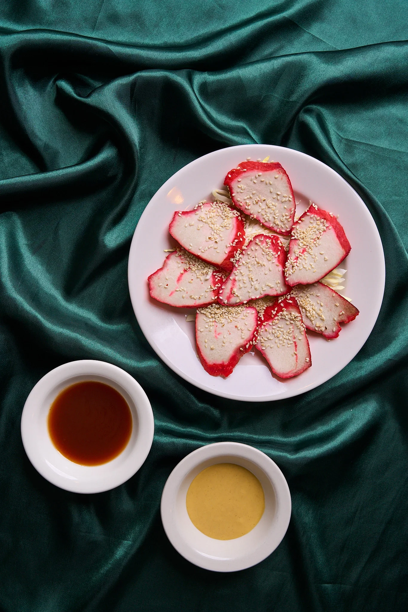 Sliced Chinese BBQ pork with sesame seeds