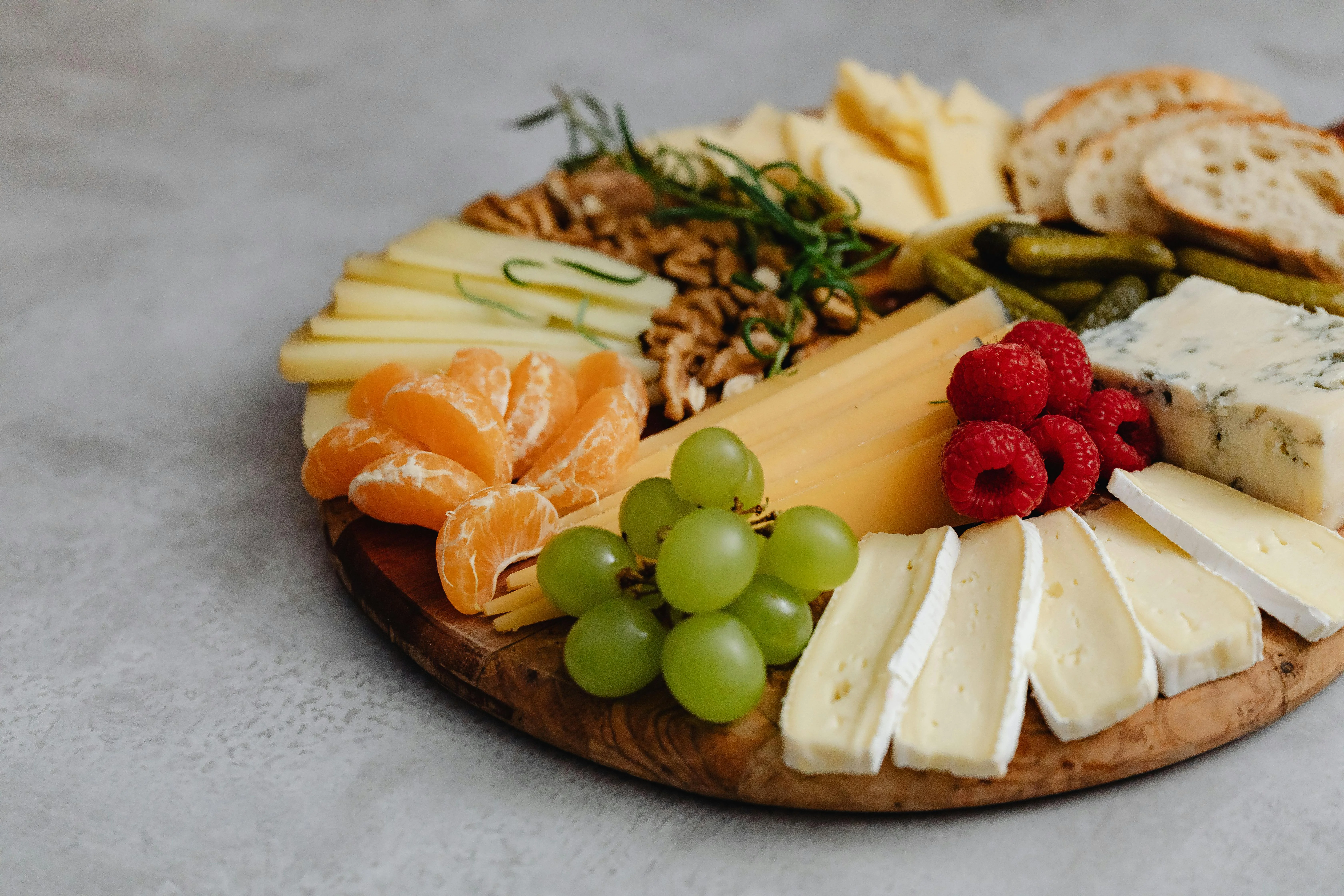 Artisan cheese platter with fruits and nuts