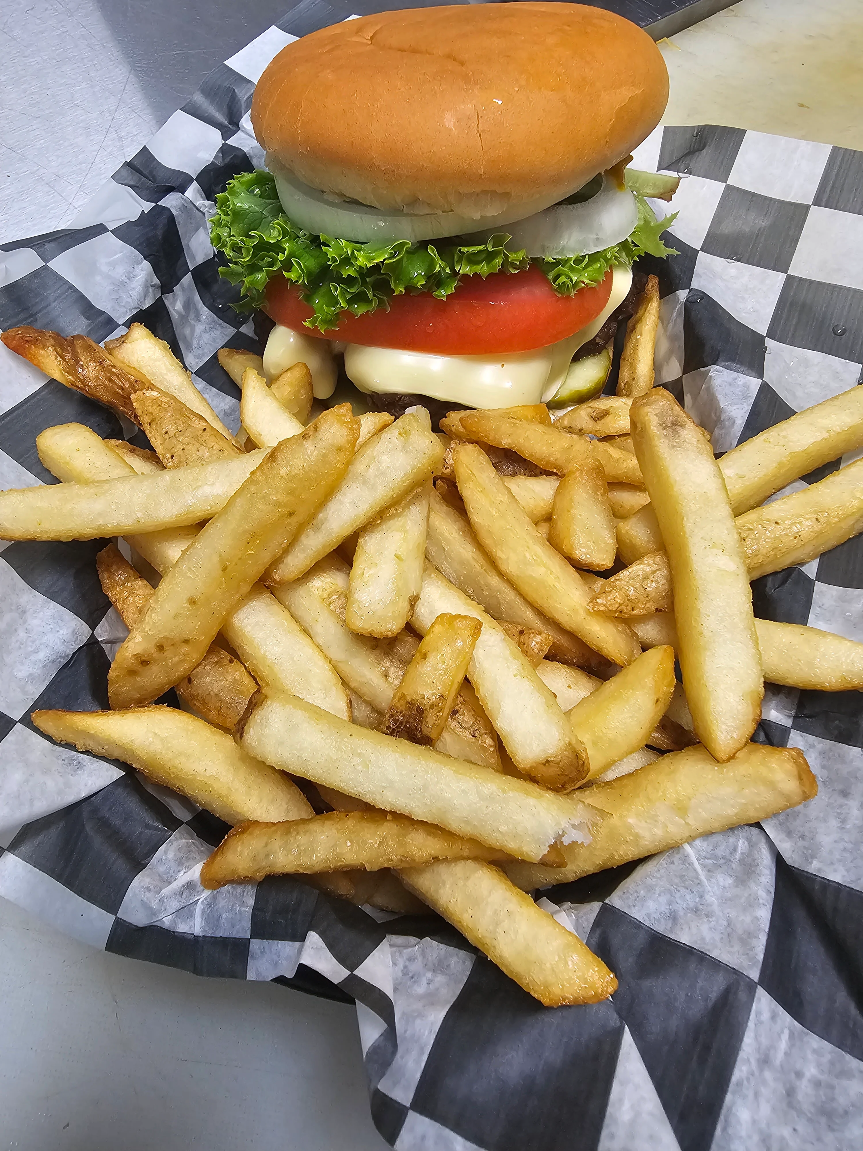 Classic American cheeseburger with fries