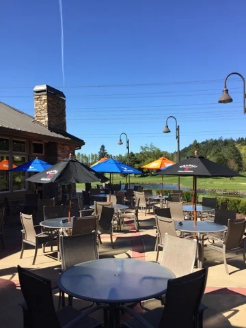 Outdoor dining area with colorful umbrellas and scenic views