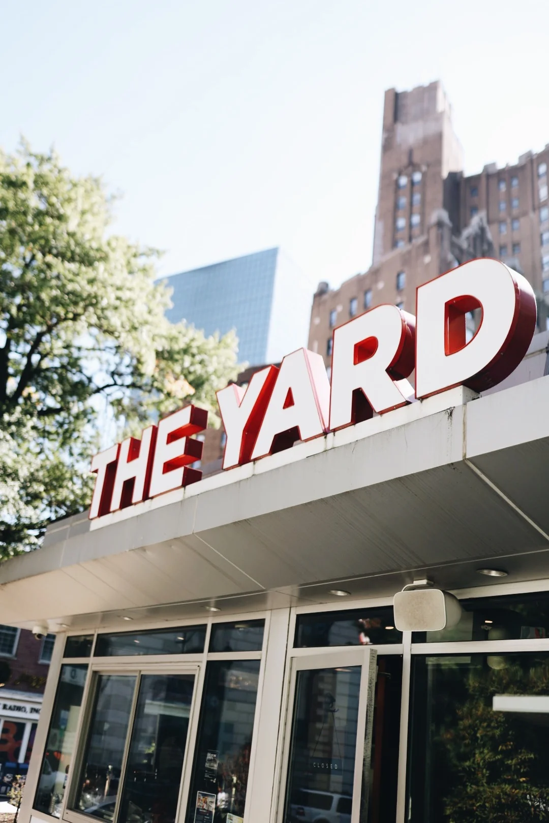 Exterior view of The Yard restaurant with bright signage