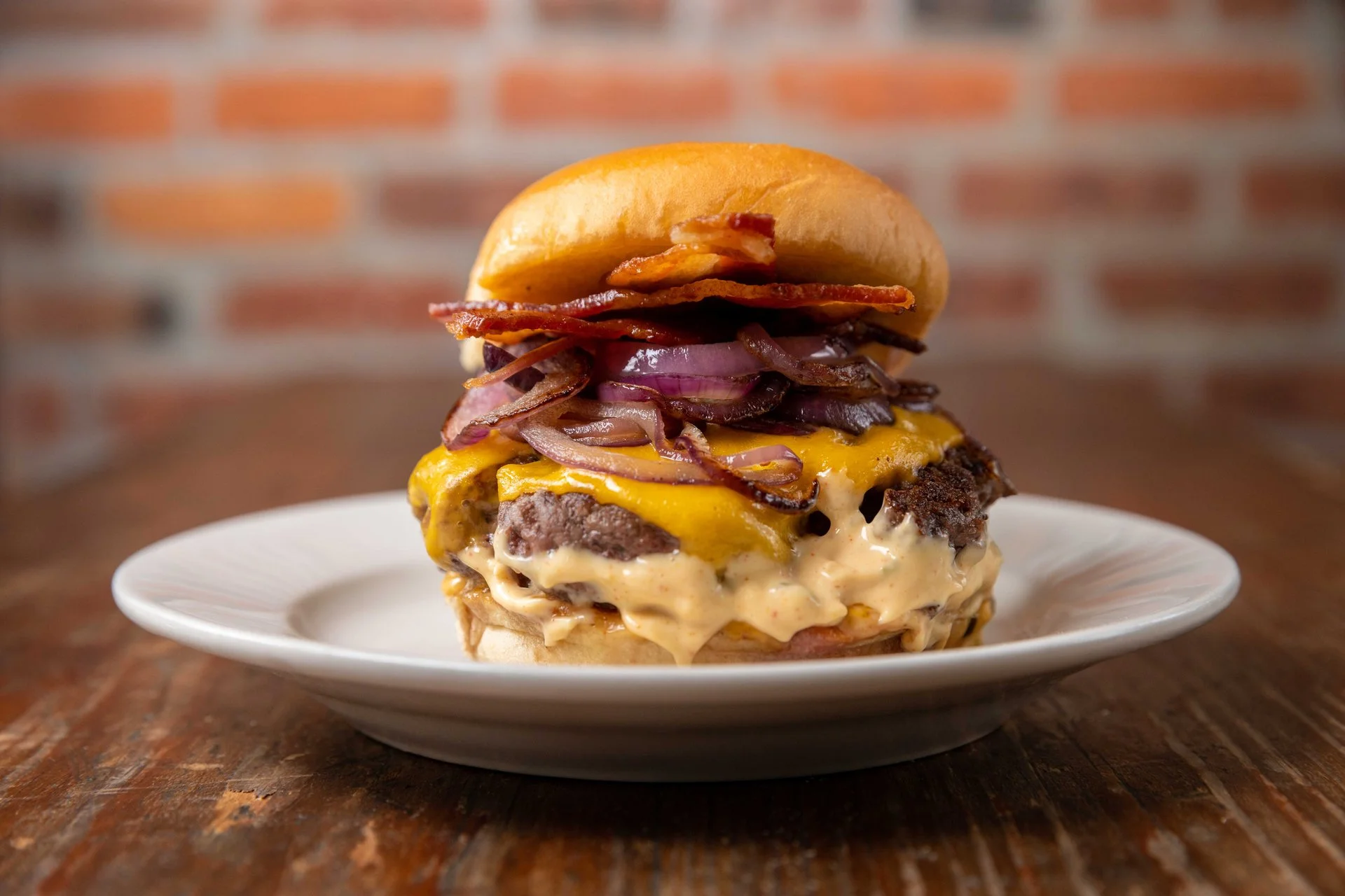 Juicy cheeseburger with bacon and caramelized onions