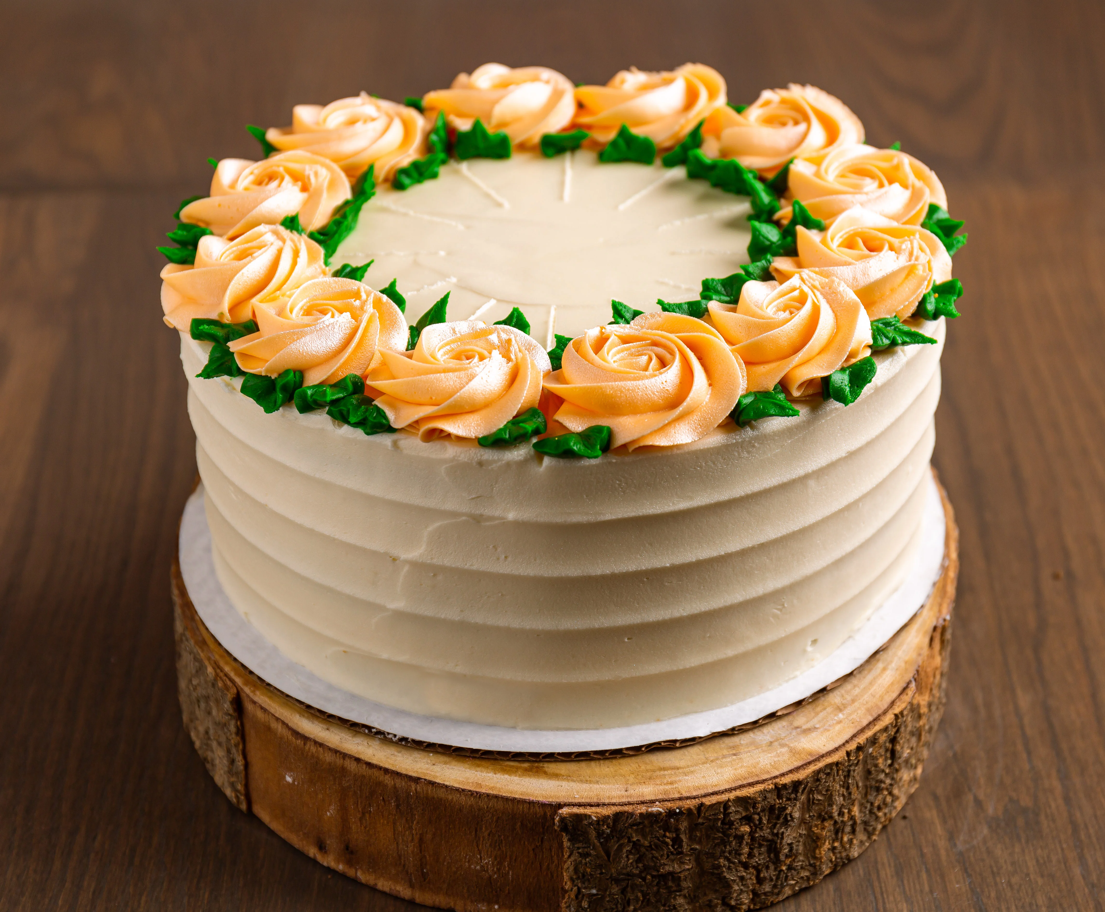 Elegant buttercream cake with rose decorations