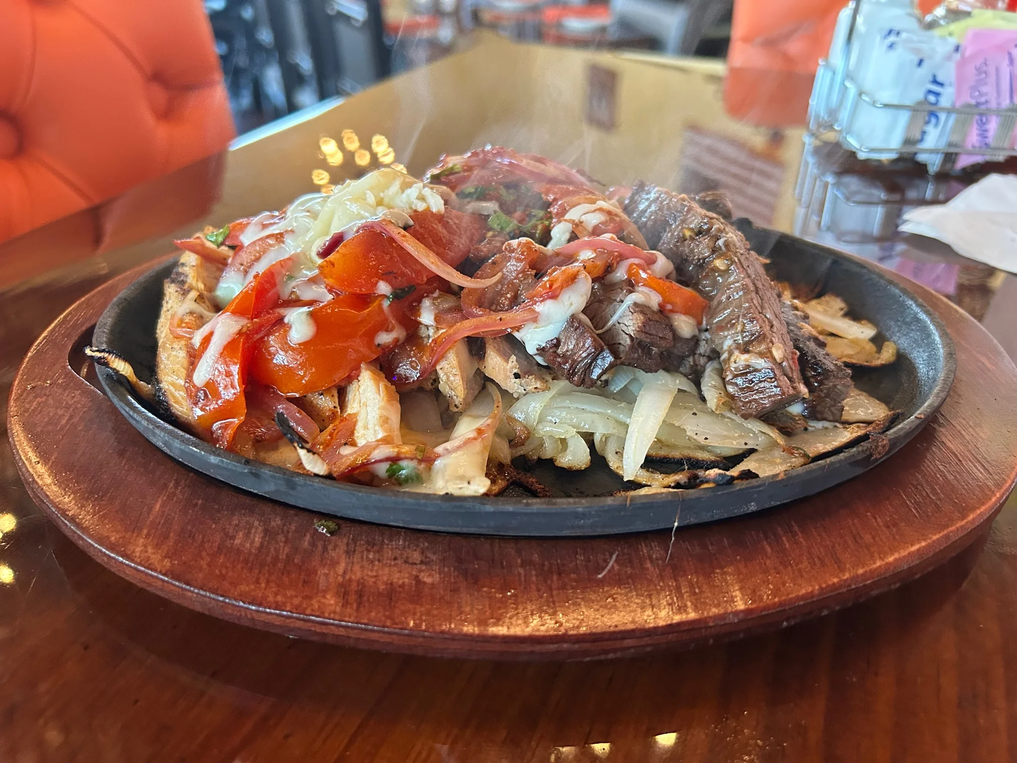 Sizzling fajitas served on a hot skillet