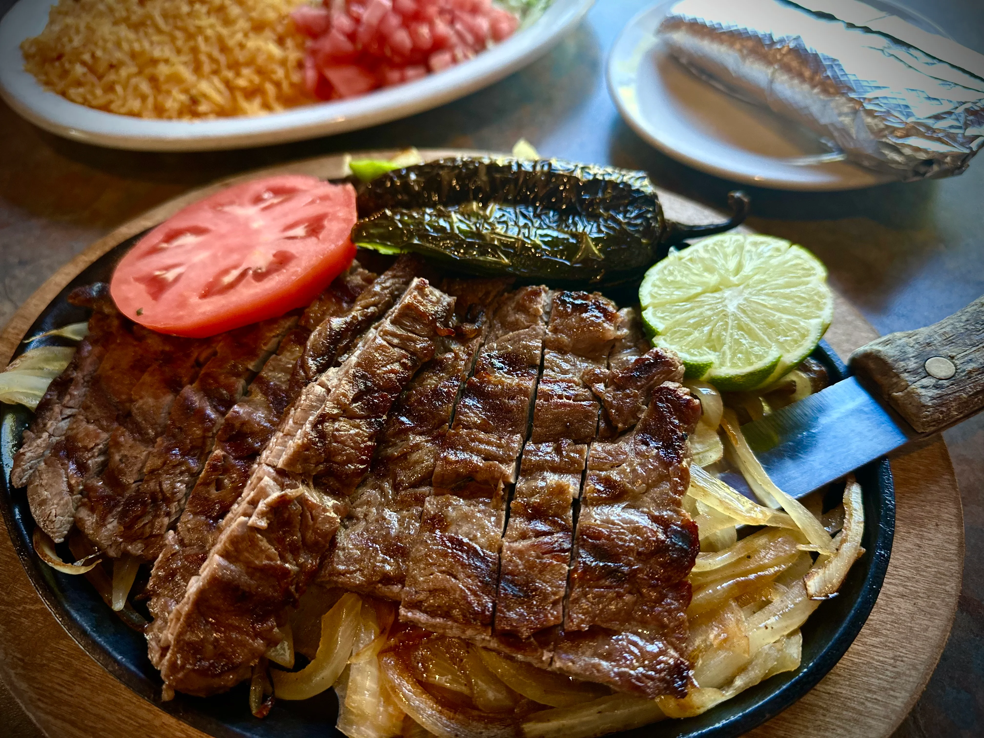 Delicious gourmet burger with fresh toppings on a wooden table