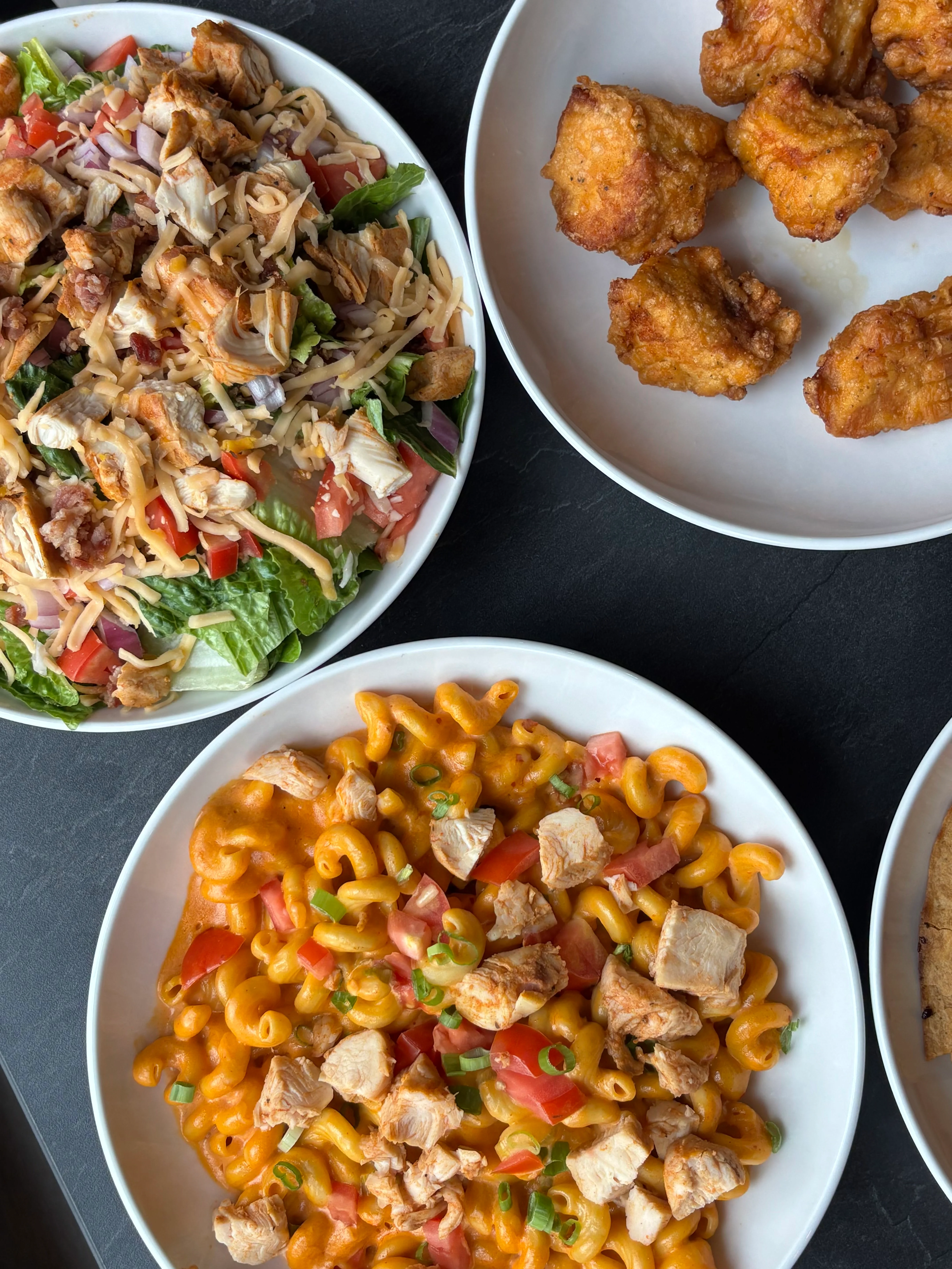 Creamy chicken mac and cheese with salad and fried chicken