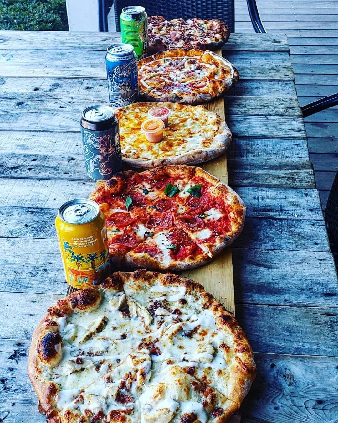 Delicious gourmet burger with fresh toppings on a wooden table