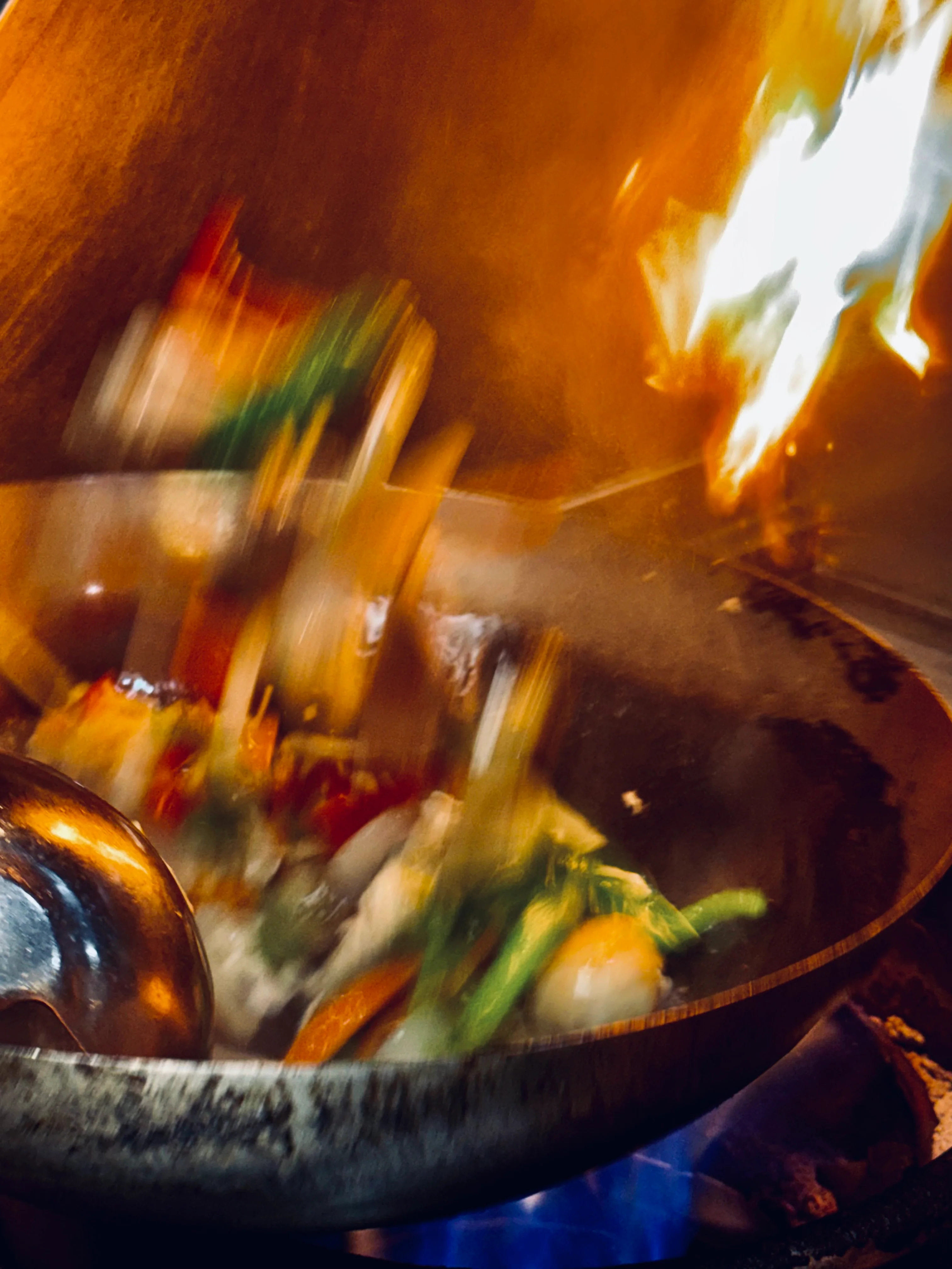 Unclear blurred close-up image with warm orange and blue lighting