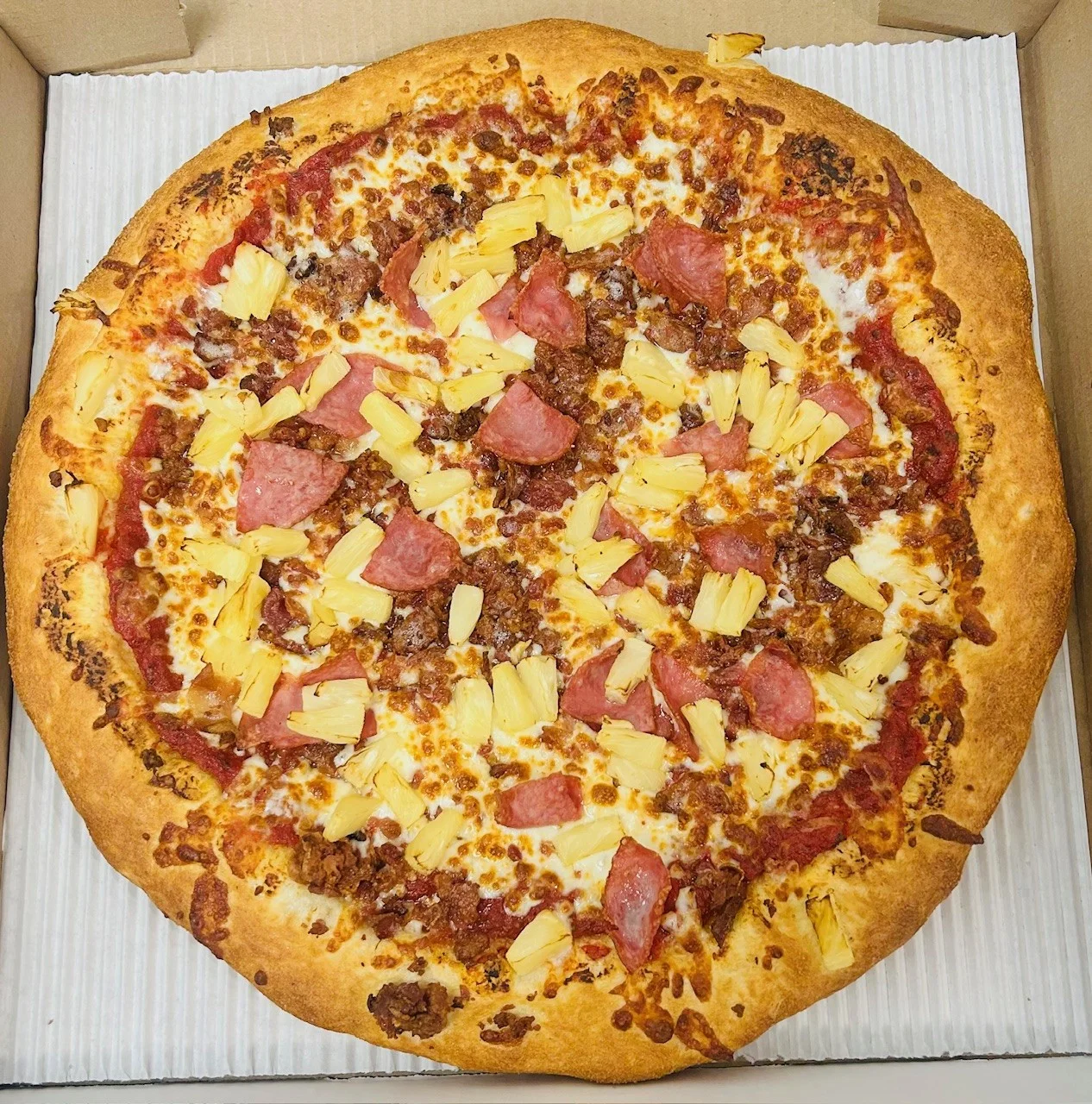 Hawaiian pizza with ham and pineapple