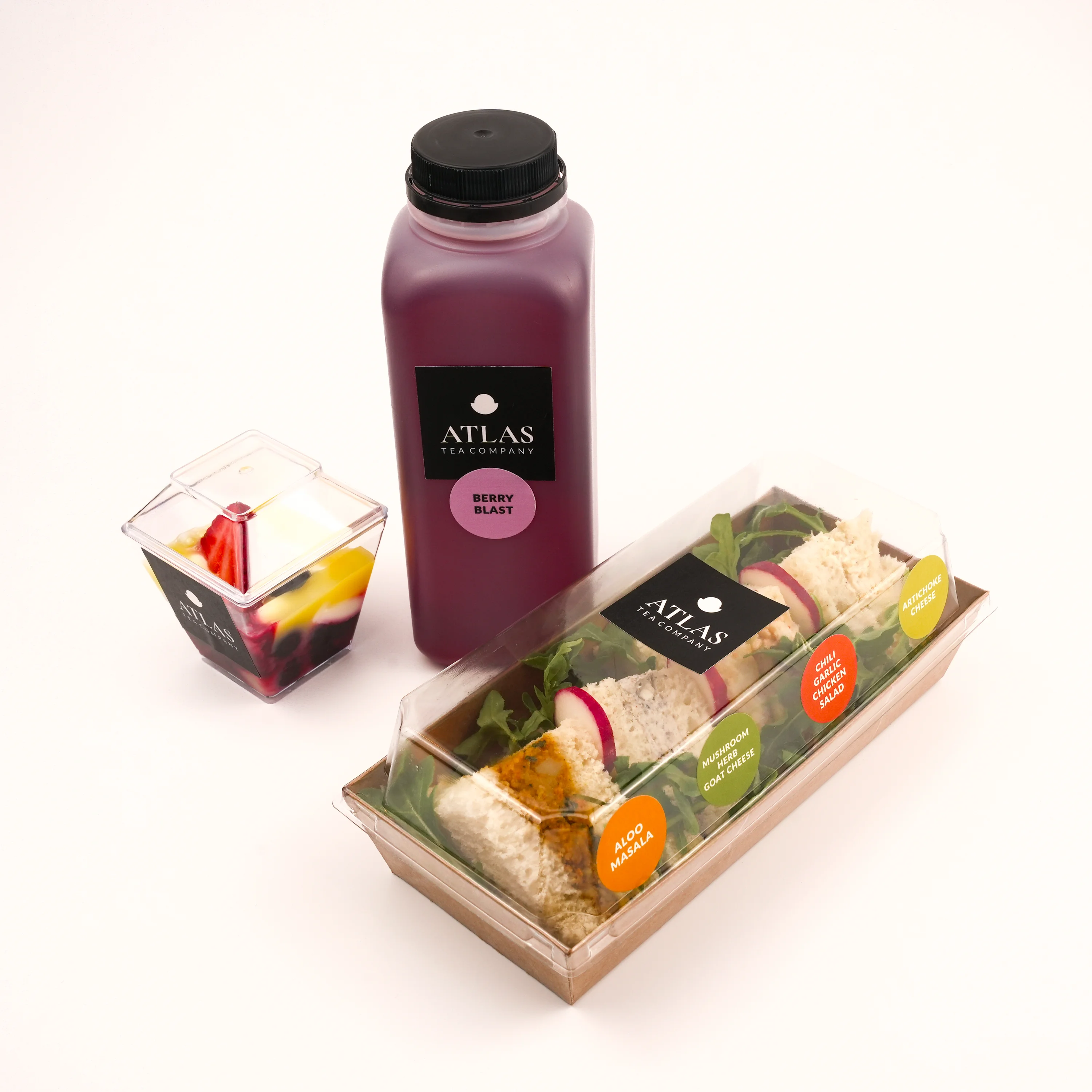 Assorted wraps and berry drink from a modern café