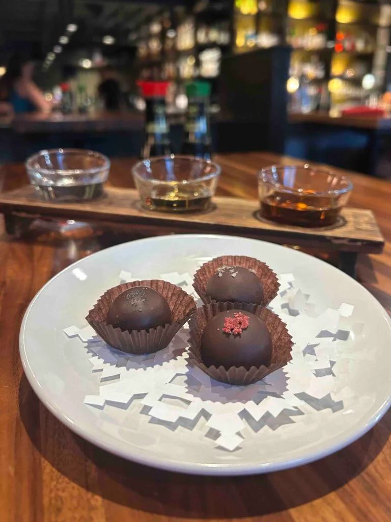 Artisan chocolate truffles on a decorative plate