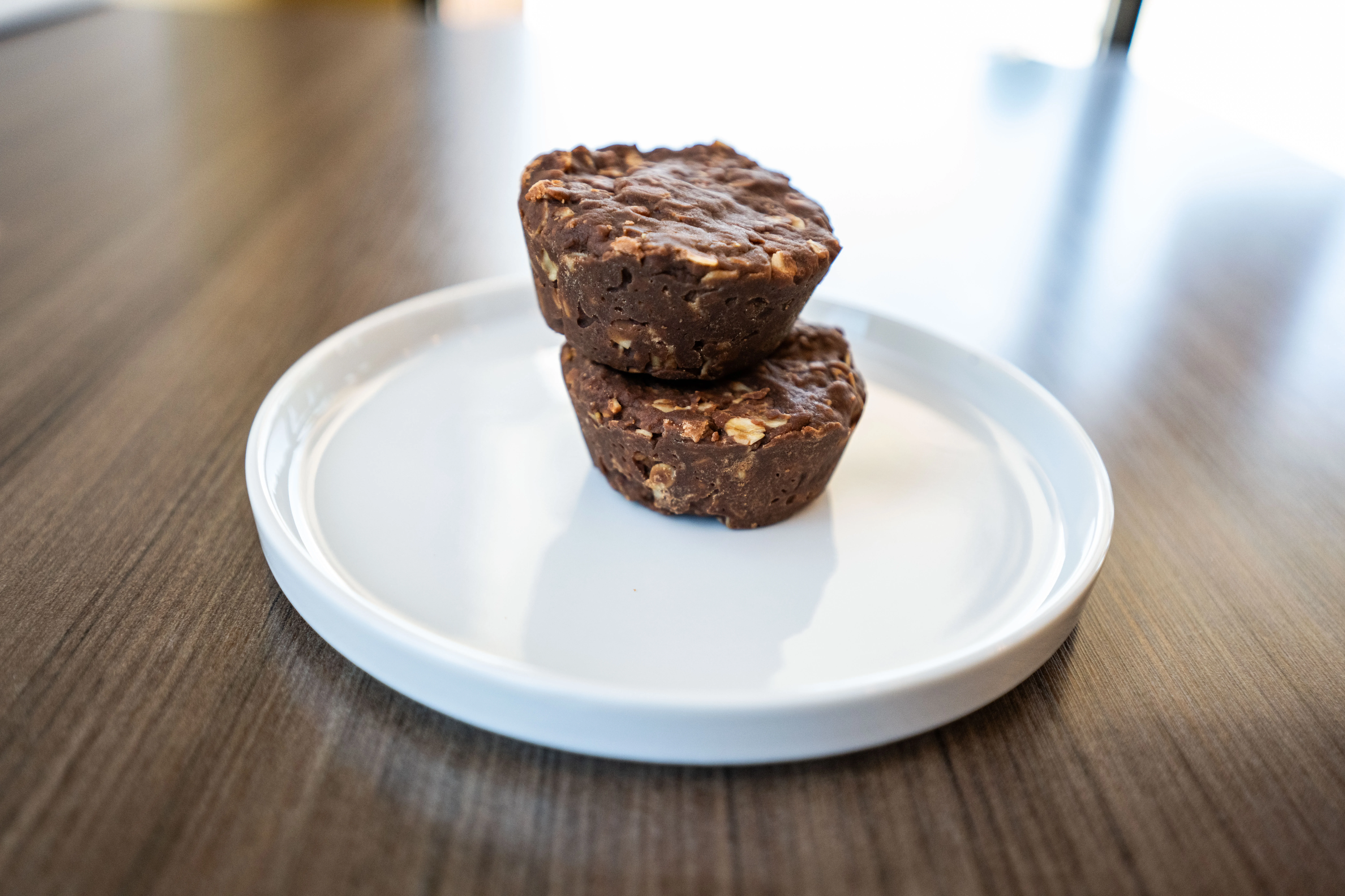 Decadent chocolate muffins on a black plate