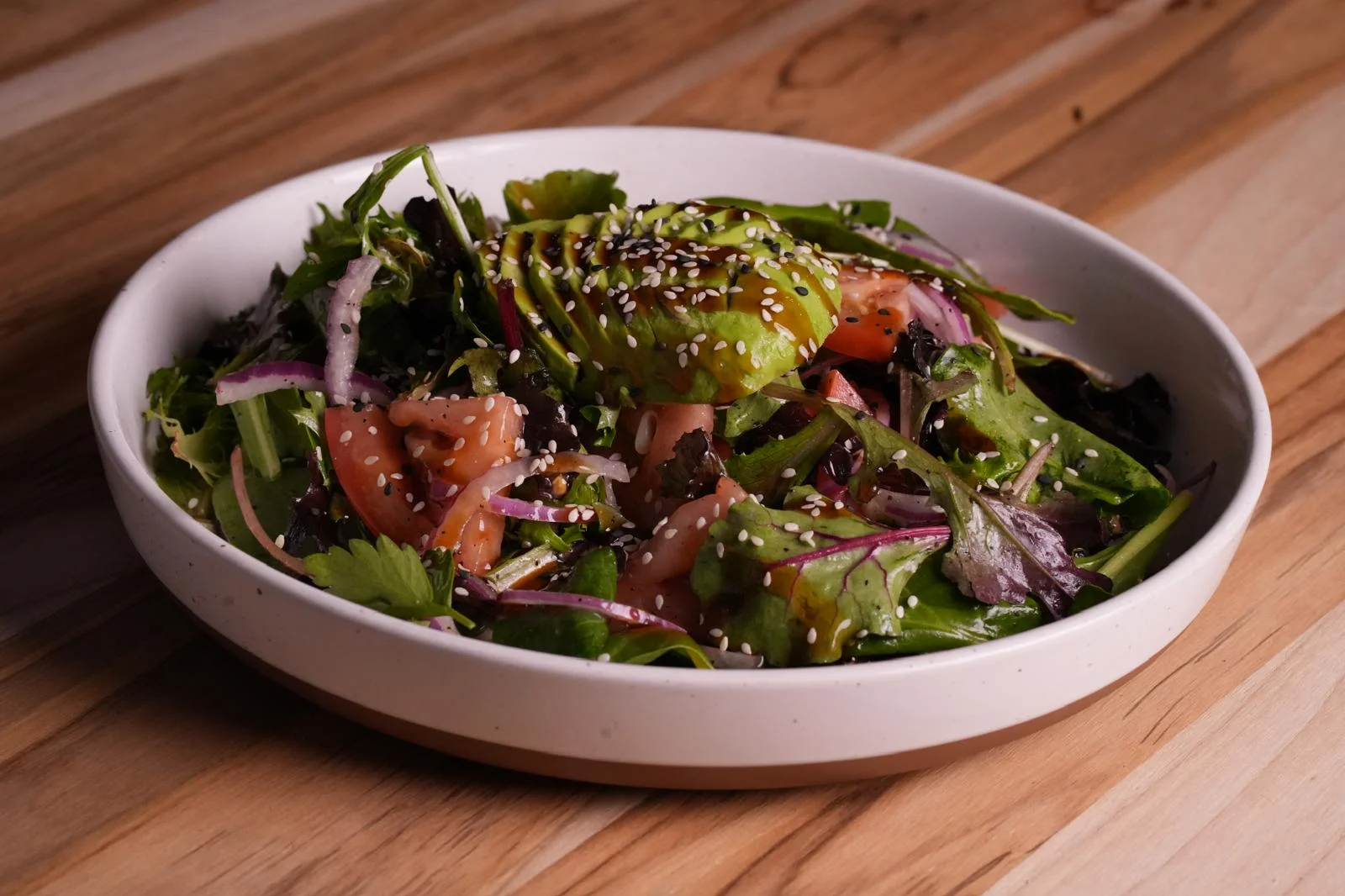 Fresh Japanese sashimi salad with avocado and sesame