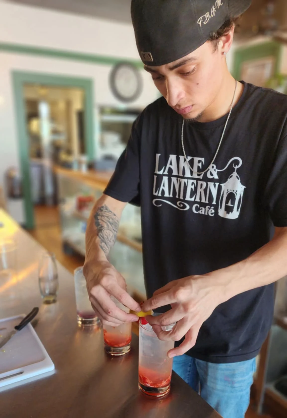 Bartender preparing cocktails at a cafe bar