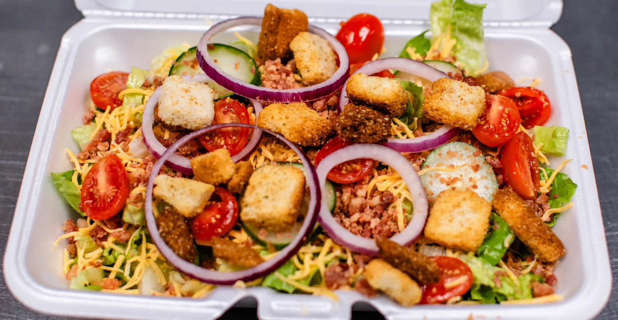 Fresh garden salad with croutons and cherry tomatoes