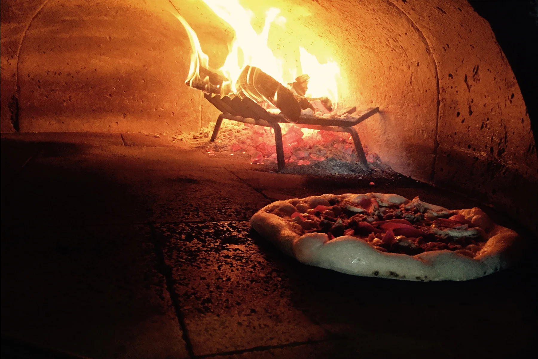 pizza cooking in the pizza oven