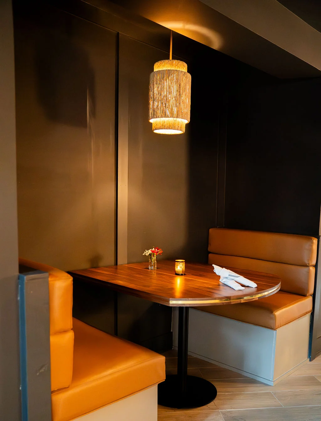 Candlelit booth at Firetender inside Hotel Manteo in Manteo, North Carolina