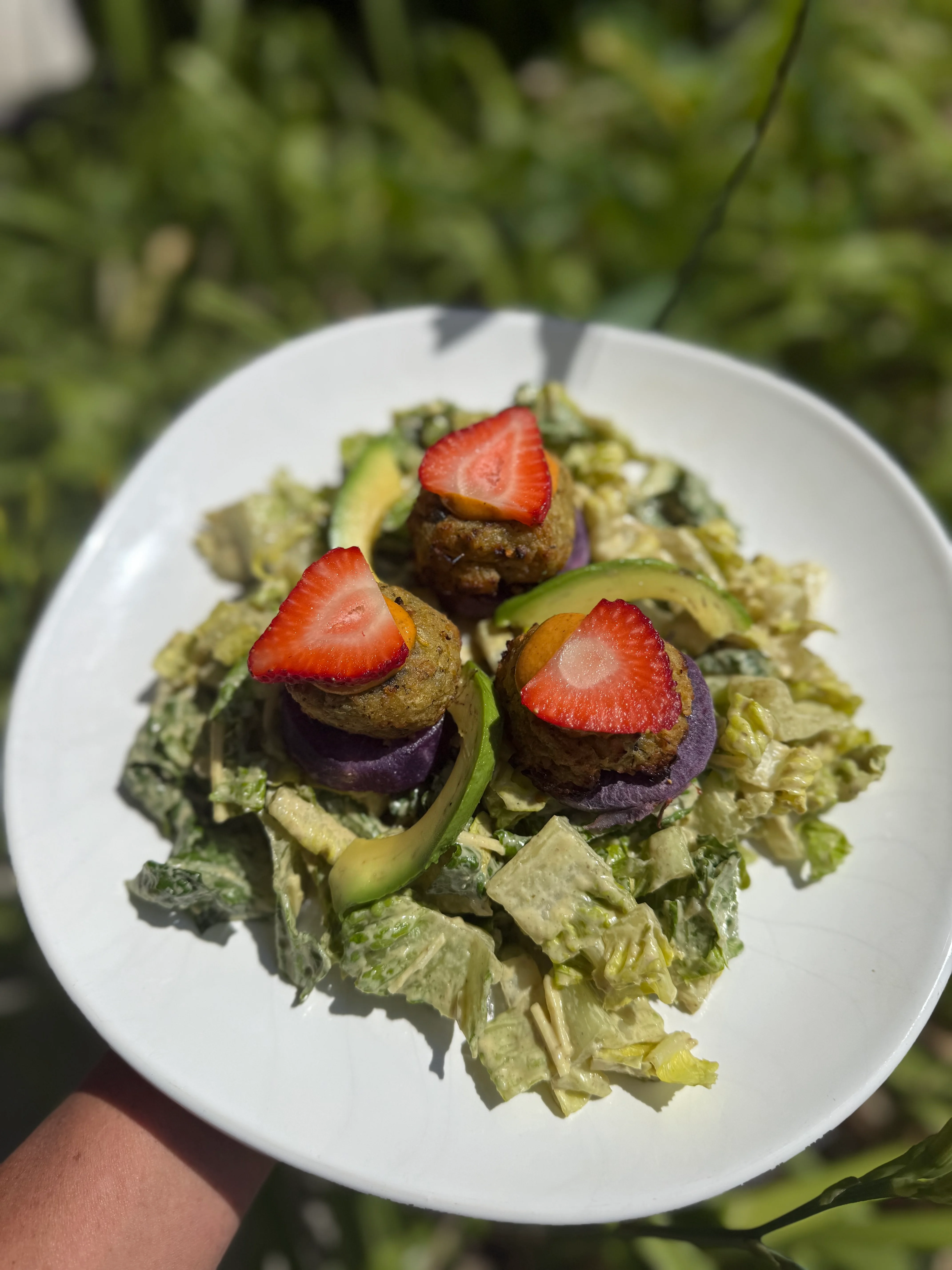 Vegan Caesar salad with falafel and strawberries