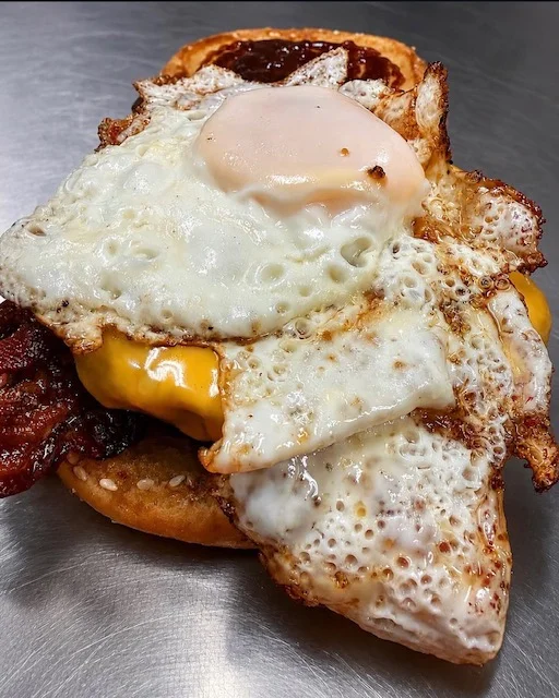 Delicious breakfast sandwich with fried eggs and cheese