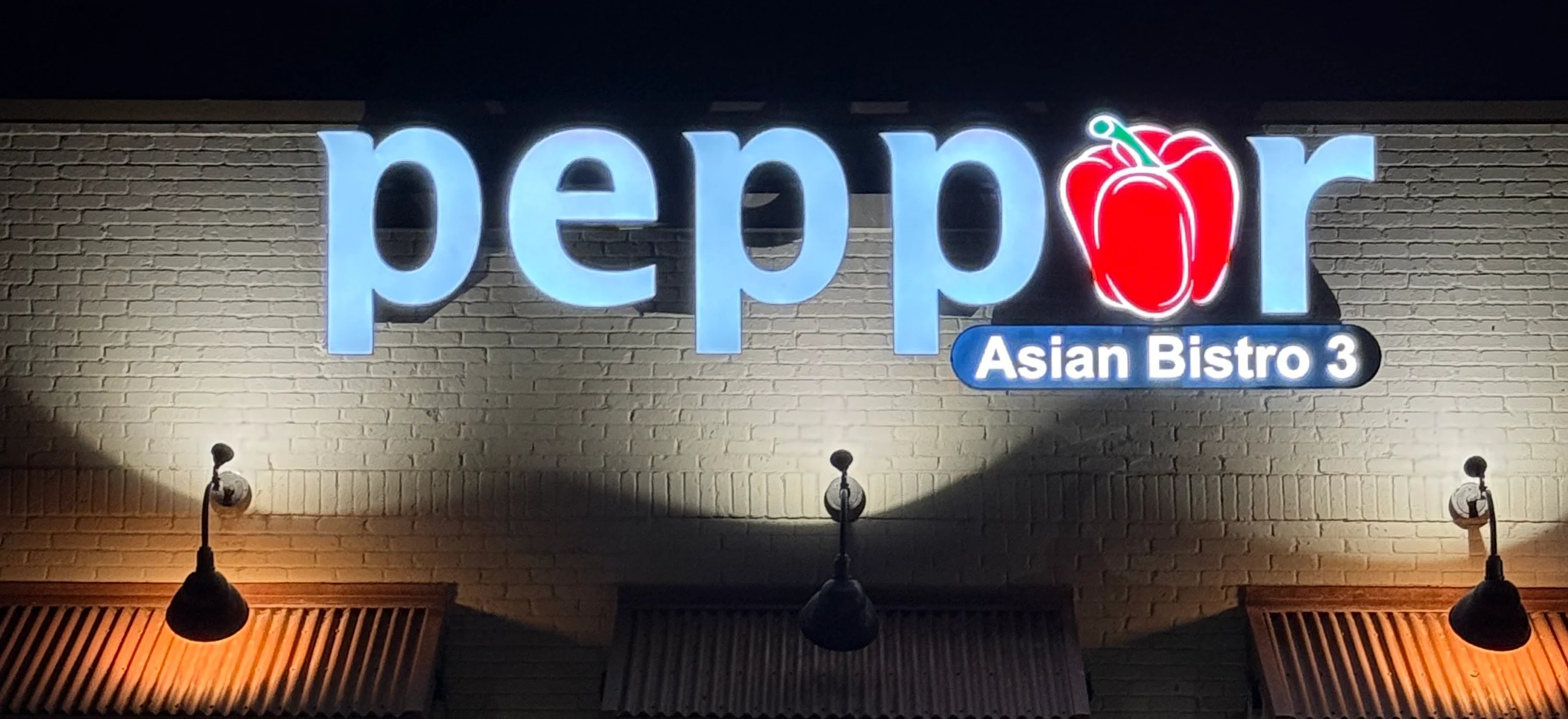 Exterior view of Peppor Asian Bistro 3 at night