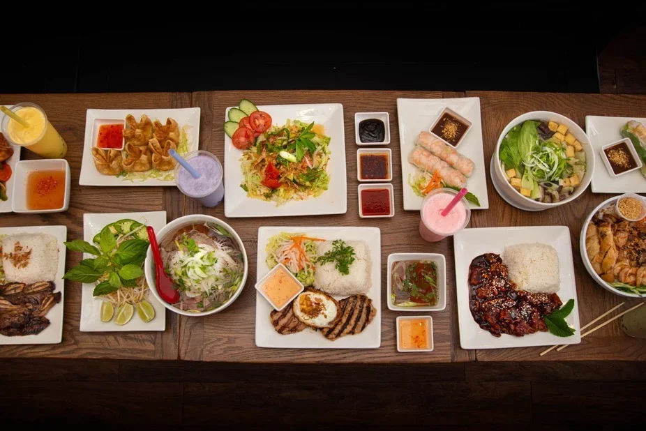Assorted Vietnamese dishes including pho and spring rolls