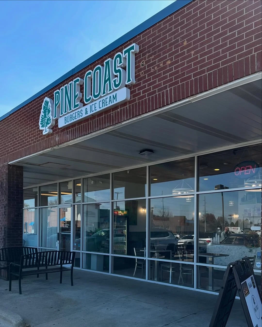 Exterior of Pine Coast Burgers & Ice Cream restaurant with open sign