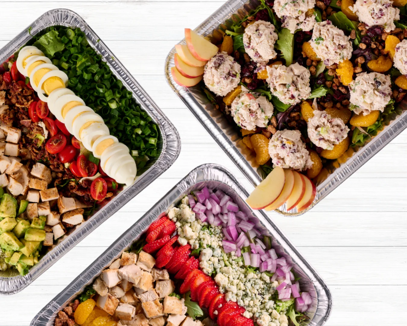 A beautifully arranged catering spread with various dishes and garnishes.