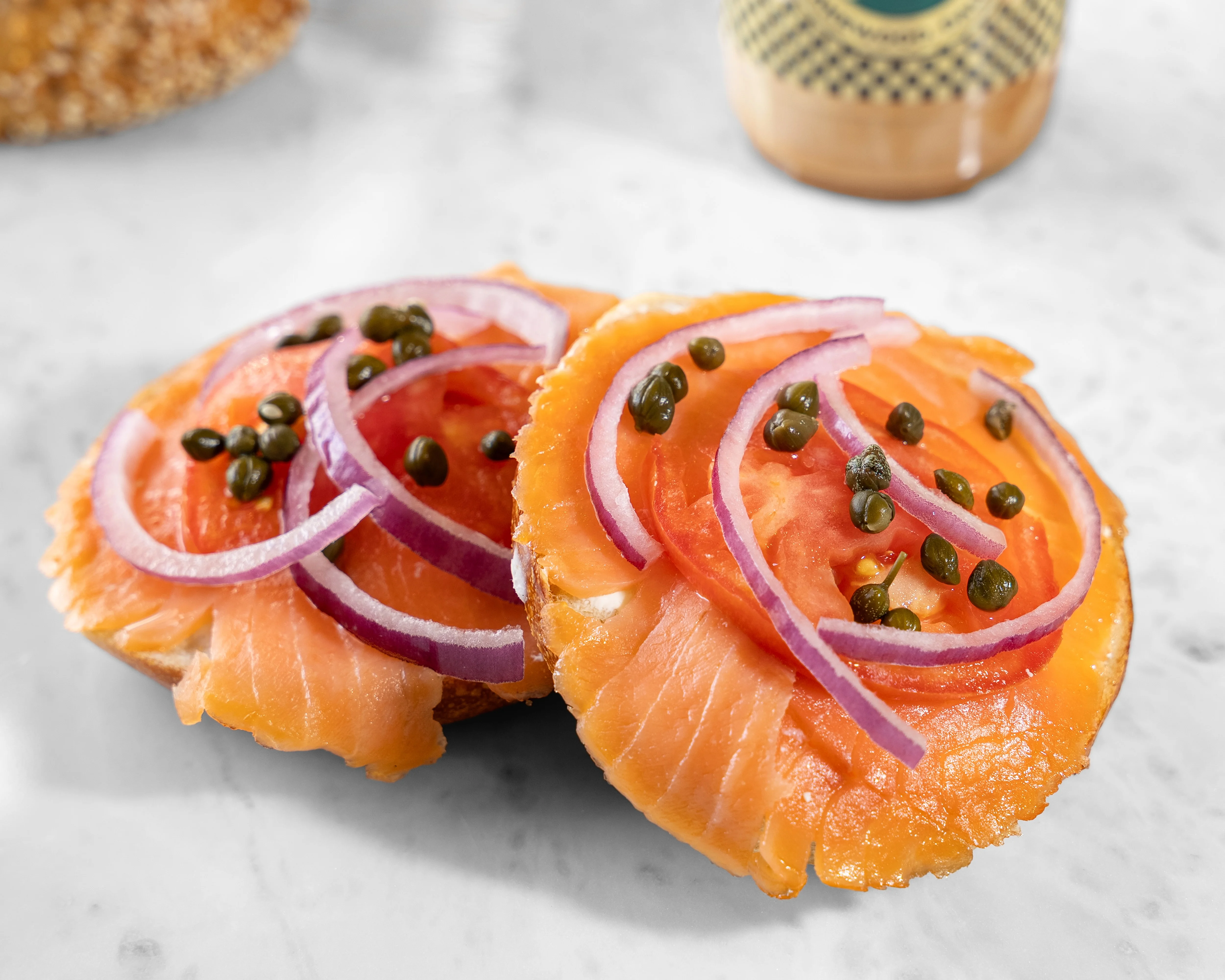 Classic lox sandwich with smoked salmon, cream cheese, and capers on a bagel.