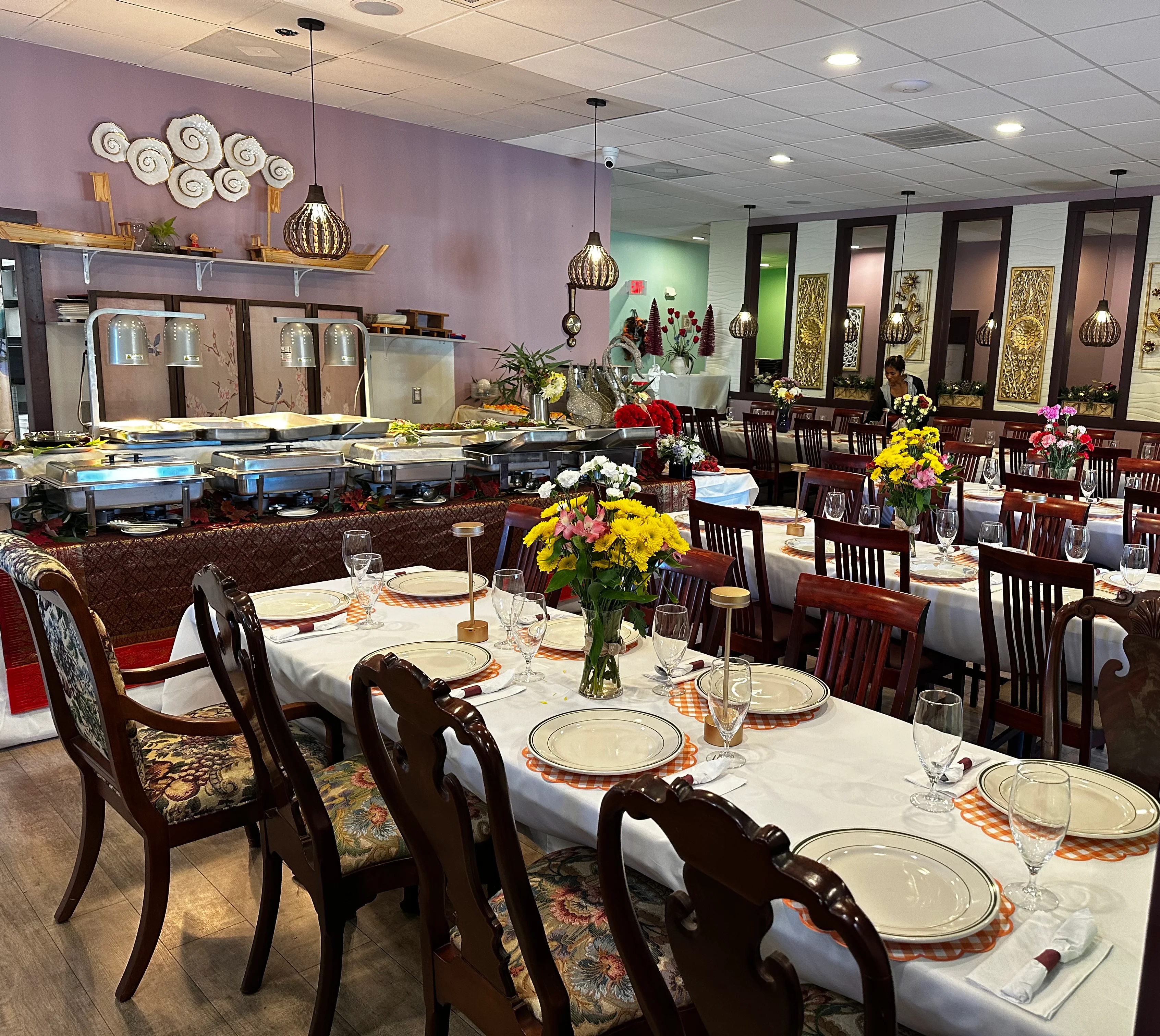 Elegant restaurant interior with floral table settings