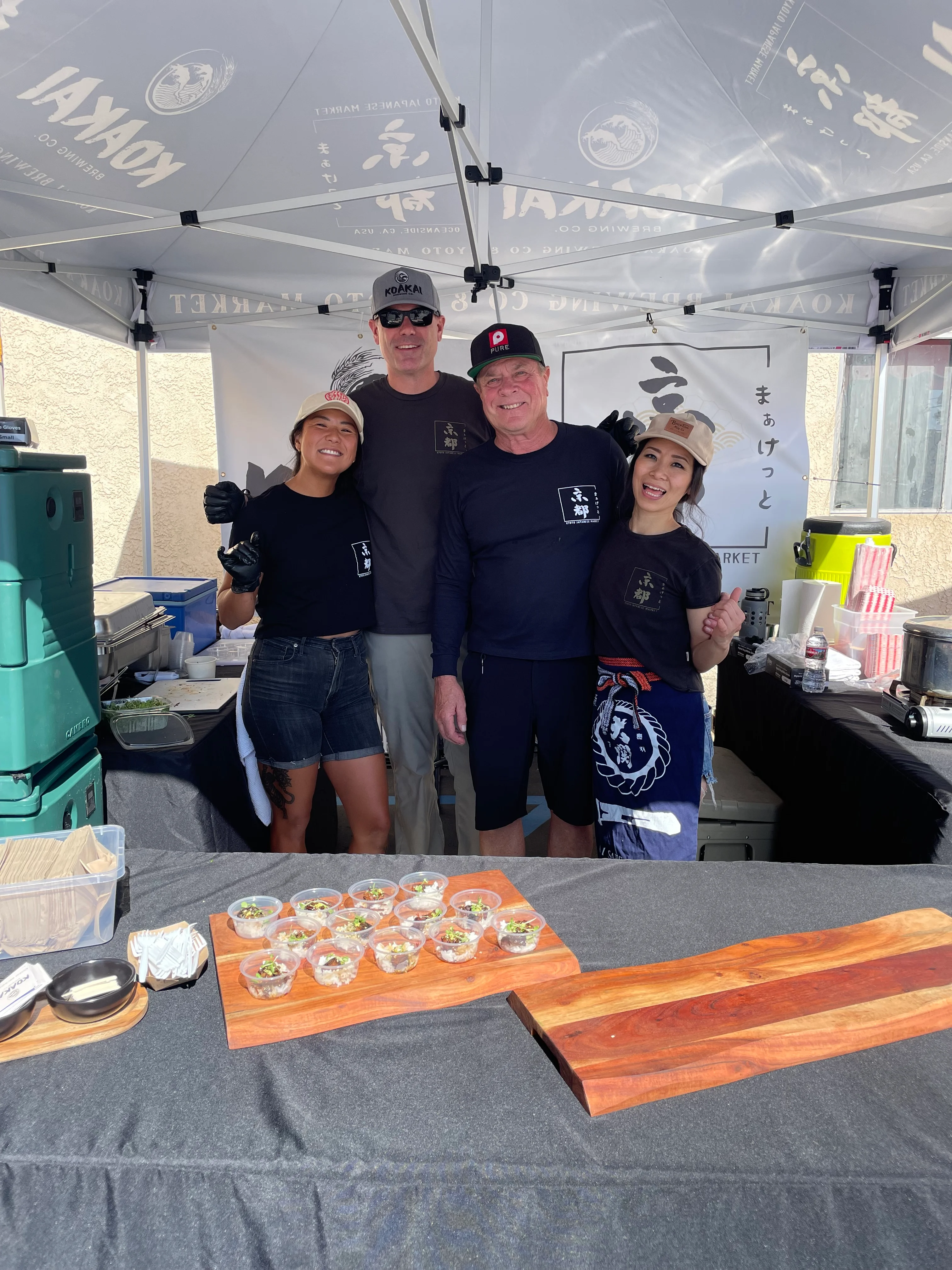 Culinary team showcasing Japanese sushi dishes at a food festival