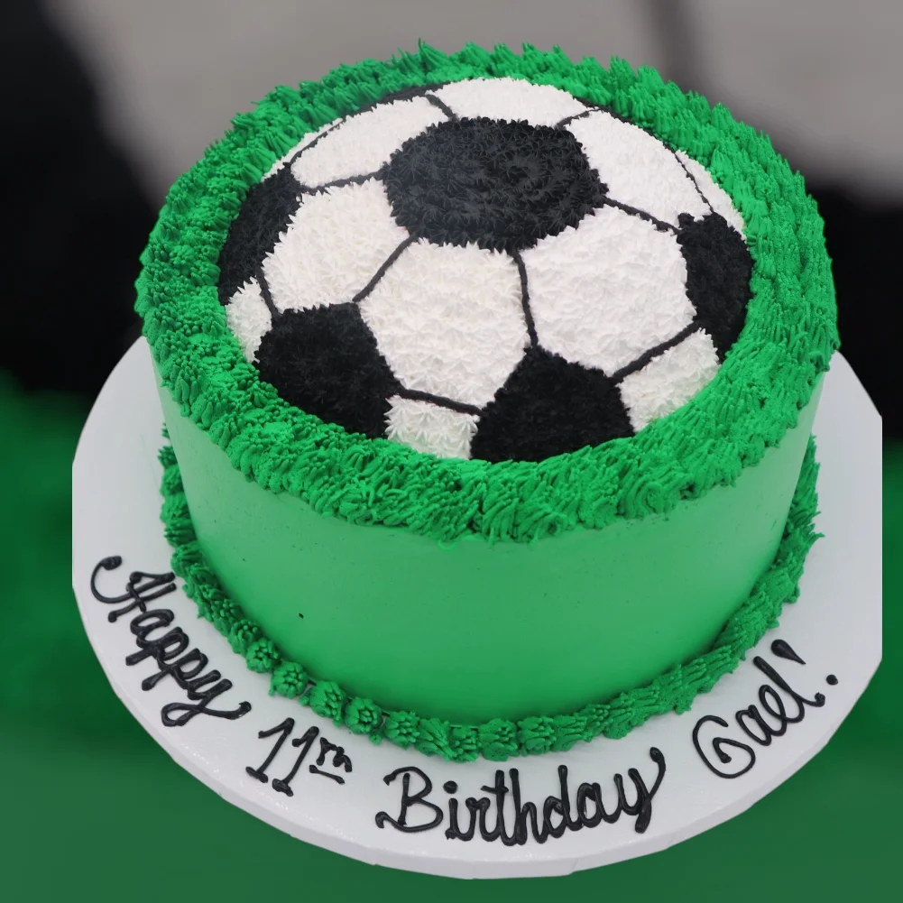 Soccer-themed birthday cake with green frosting