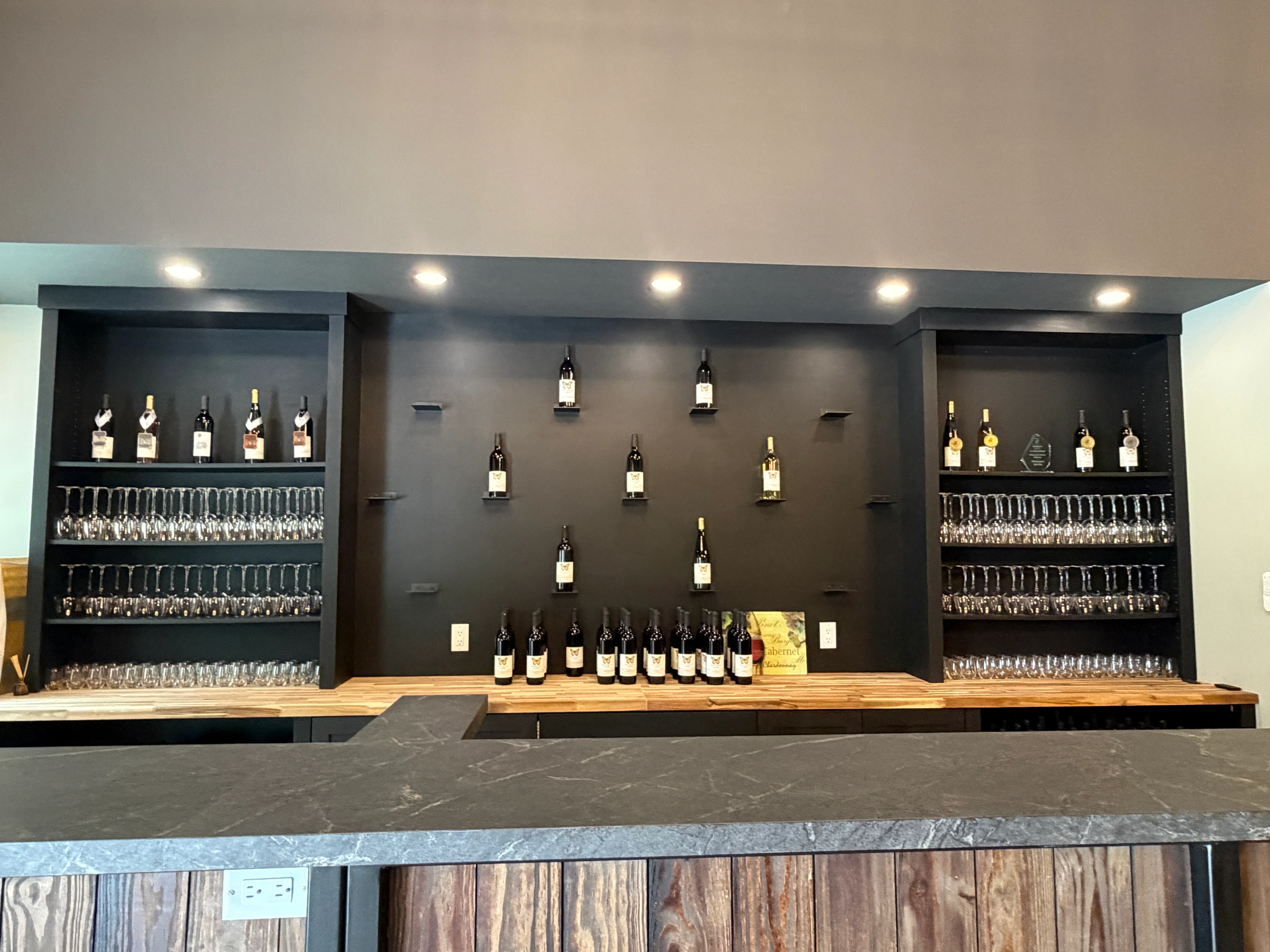 Modern wine bar display with bottles and glasses