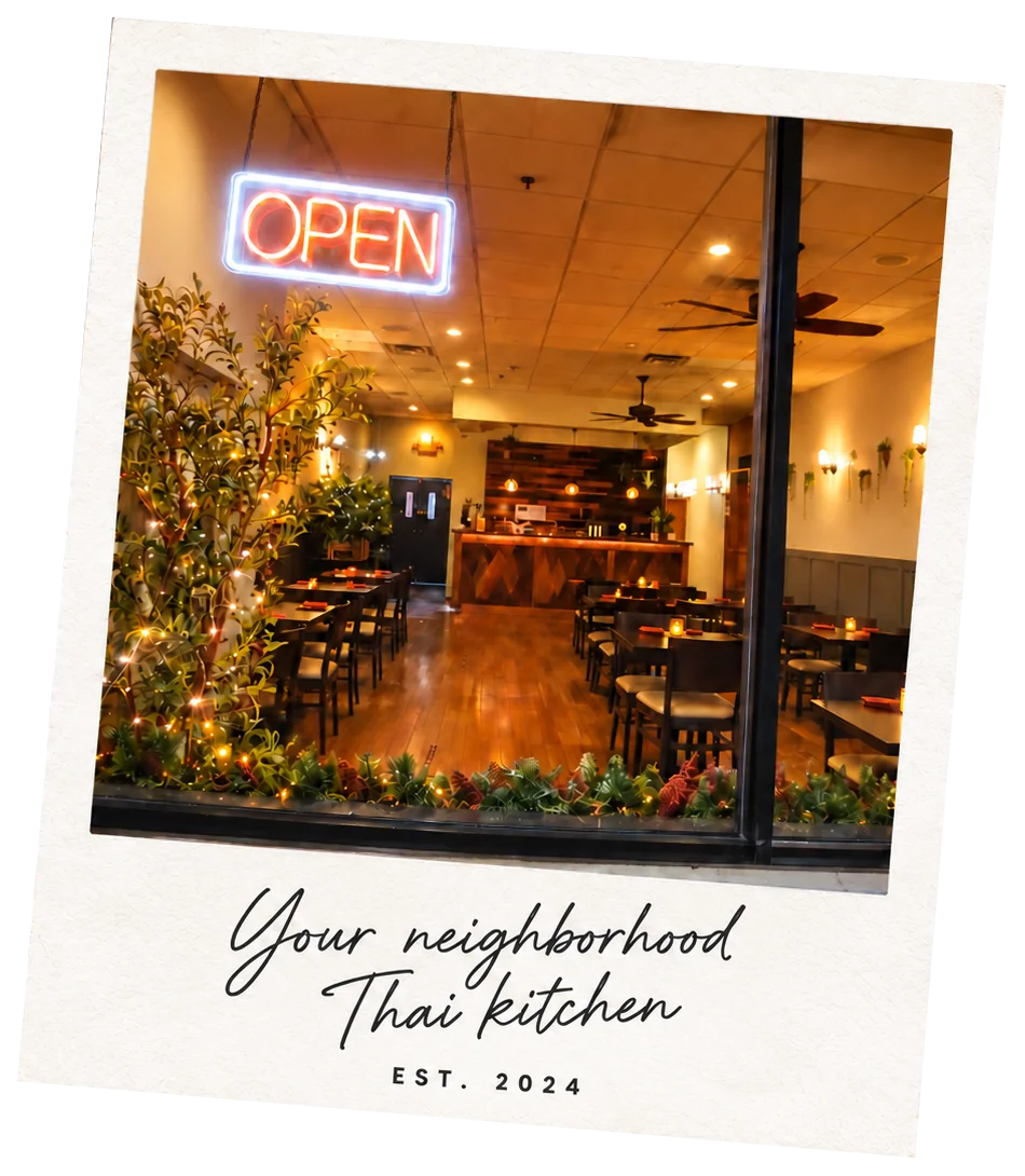 Cozy Thai restaurant interior with open sign and warm lighting