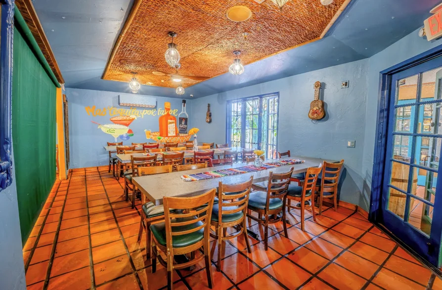 Colorful restaurant interior with rustic decor and wooden tables