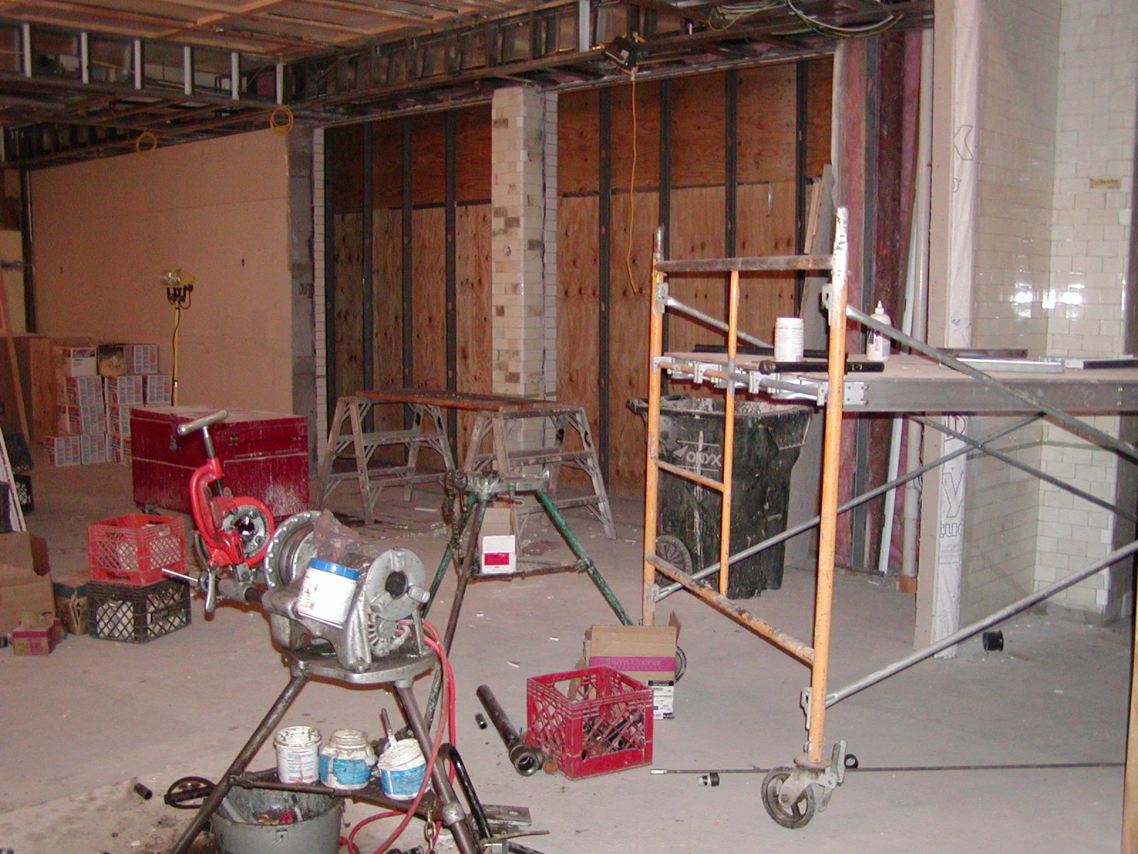 Construction site interior with tools and scaffolding