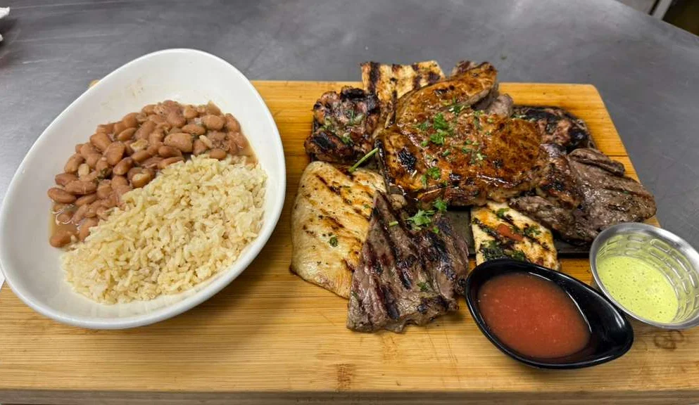 Mixed grill platter with rice and beans